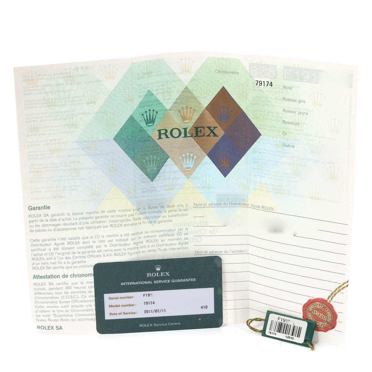 The image shows a Rolex Datejust 79174 Women's Stainless Steel Black Dial 79174 Women's Stainless Steel Black Dial warranty card, booklet, and tags laid out on a flat surface.