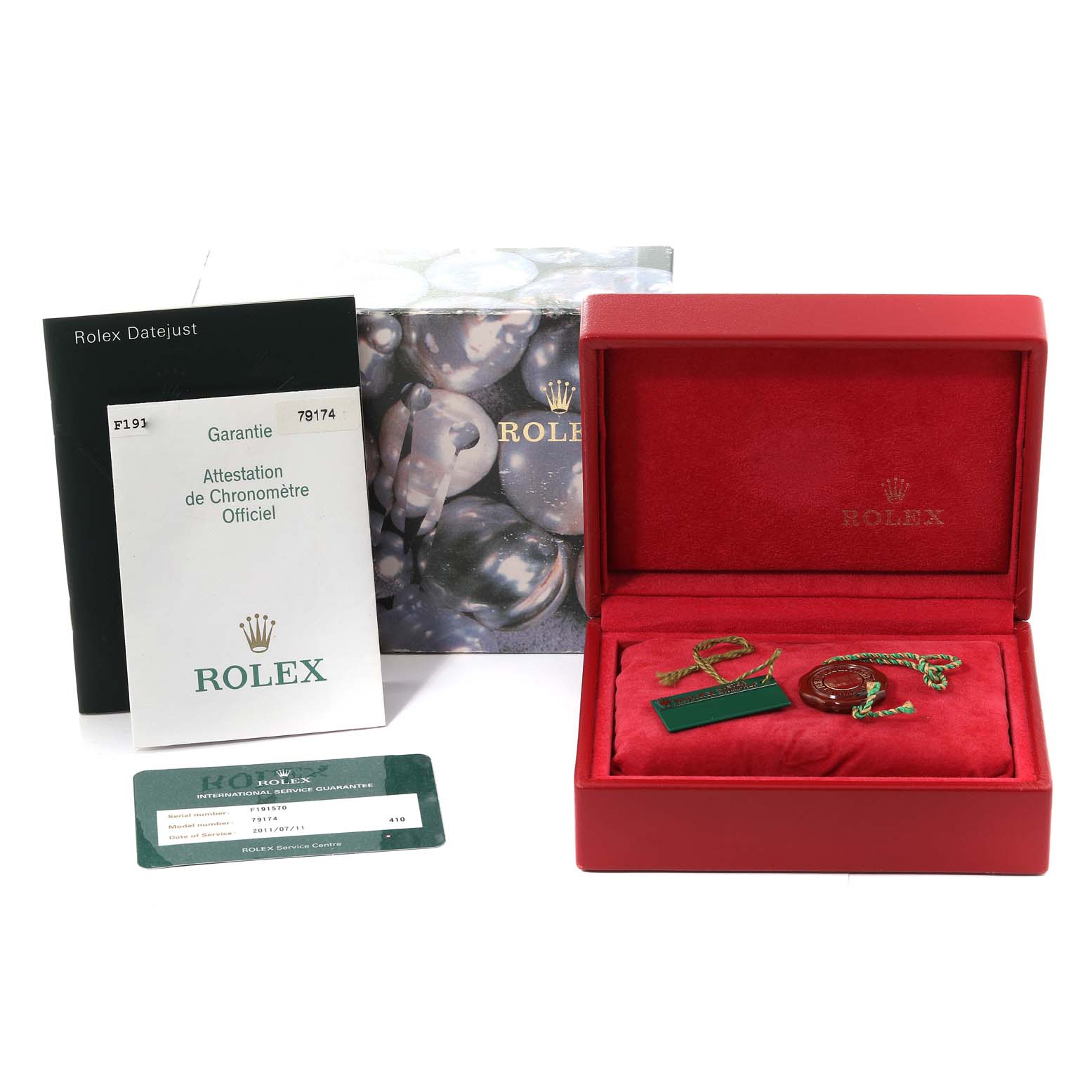 The image shows a Rolex Datejust 79174 Women's Stainless Steel Black Dial 79174 Women's Stainless Steel Black Dial box, manual, guarantee card, and tags from a frontal angle.