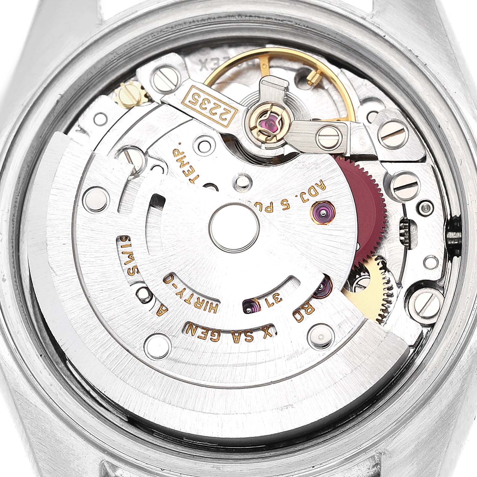 This is a close-up shot of the internal mechanism of a Rolex Datejust 79174 Women's Stainless Steel Black Dial 79174 Women's Stainless Steel Black Dial watch, showing gears and other movement components.