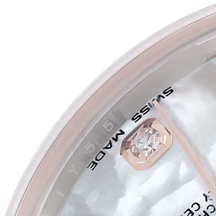 The image shows a close-up of a Rolex Mid-Size 178271 Women's Steel and Gold (two tone) Mother of Pearl Dial 178271 Women's Steel and Gold (two tone) Mother of Pearl Dial model watch featuring a diamond marker and "SWISS MADE" text.