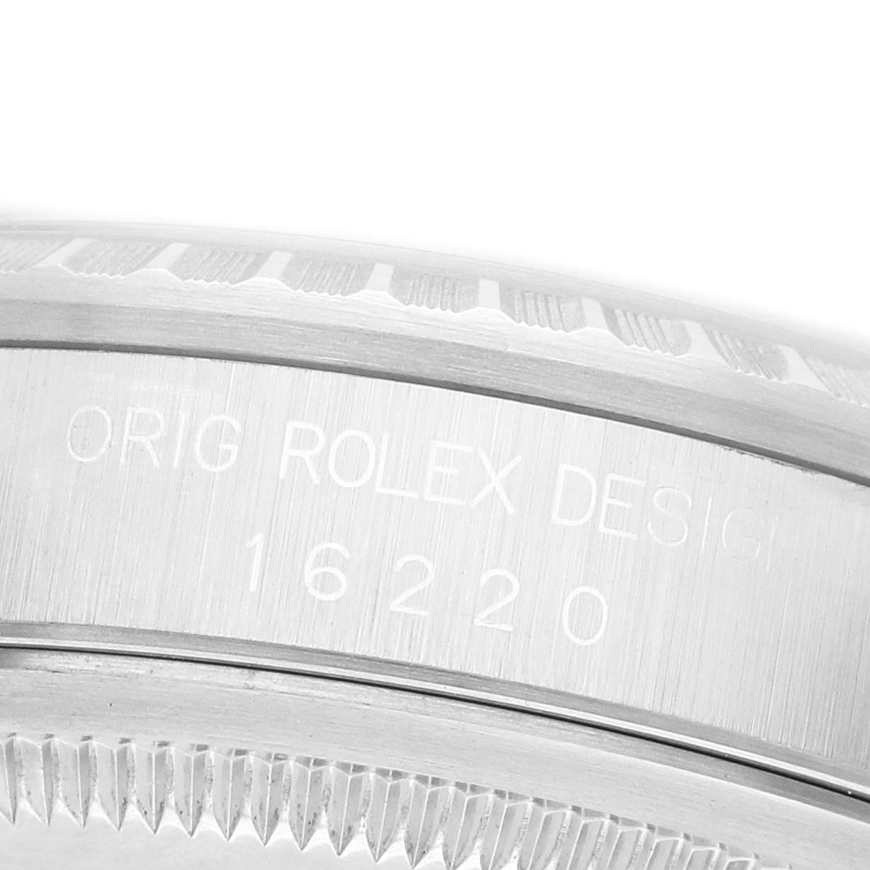 The image shows a close-up of the side engraving on a Rolex Datejust 16220 Men's Stainless Steel Silver Dial model, highlighting the serial number.