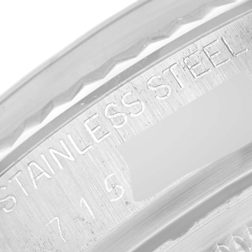 The image shows a close-up of the stainless steel engraving on the case back of a Rolex Vintage Collection 16014 Men's Stainless Steel Silver Dial 16014 Men's Stainless Steel Silver Dial watch.