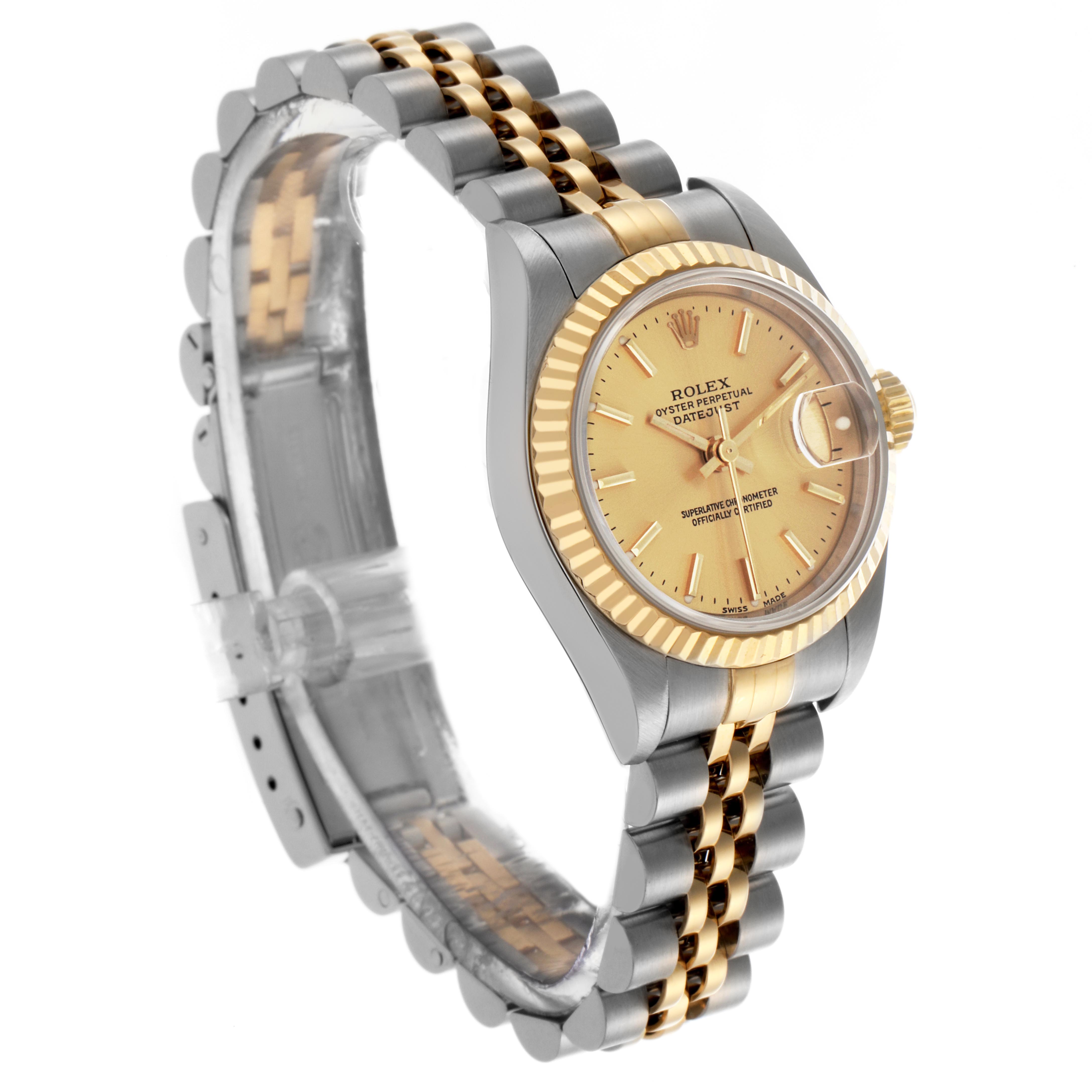The Rolex Datejust 79173 Women's Steel and Gold (two tone) Champagne Dial 79173 Women's Steel and Gold (two tone) Champagne Dial watch is shown at a three-quarter angle, highlighting the face, fluted bezel, and two-tone Jubilee bracelet.