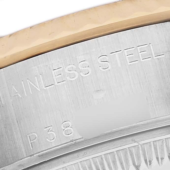 The image shows a close-up of the engraved case back edge and bezel of a Rolex Datejust 79173 Women's Steel and Gold (two tone) Champagne Dial 79173 Women's Steel and Gold (two tone) Champagne Dial watch.