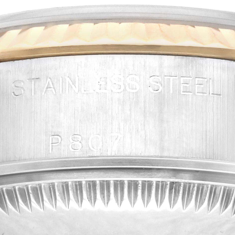 The image shows a close-up of the stainless steel case and fluted bezel of a Rolex Datejust 79173 Women's Steel and Gold (two tone) Champagne Dial 79173 Women's Steel and Gold (two tone) Champagne Dial watch.