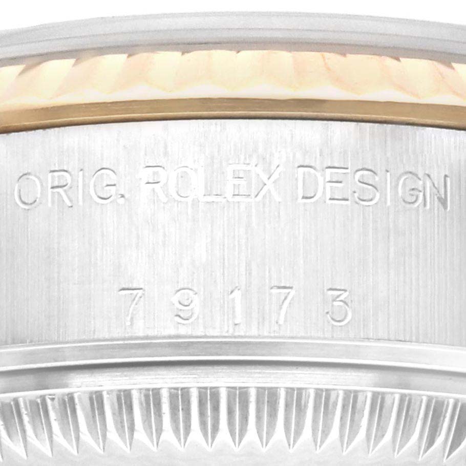This is a close-up shot of the Rolex Datejust 79173 Women's Steel and Gold (two tone) Champagne Dial 79173 Women's Steel and Gold (two tone) Champagne Dial model, showing the engraved caseback with "ORIG. ROLEX DESIGN" and model number 79173.