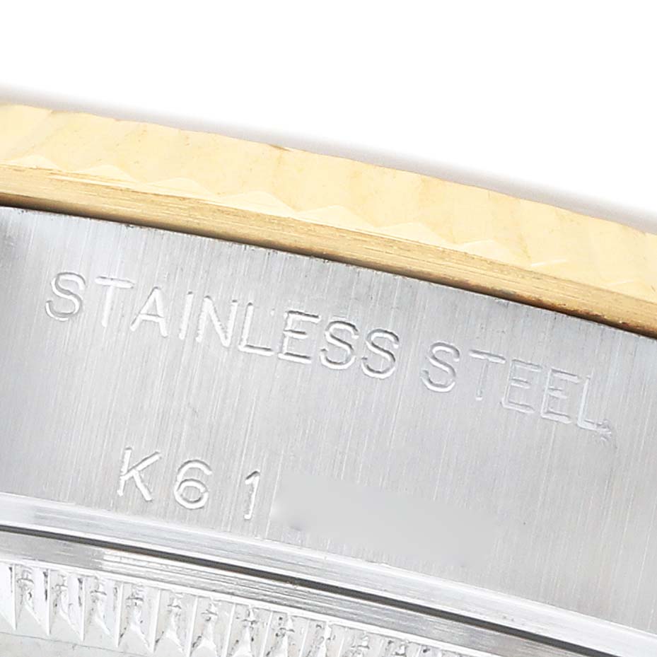 The image shows a close-up of the side of a Rolex Datejust 79173 Women's Steel and Gold (two tone) Champagne Dial watch, highlighting the "STAINLESS STEEL" engraving.