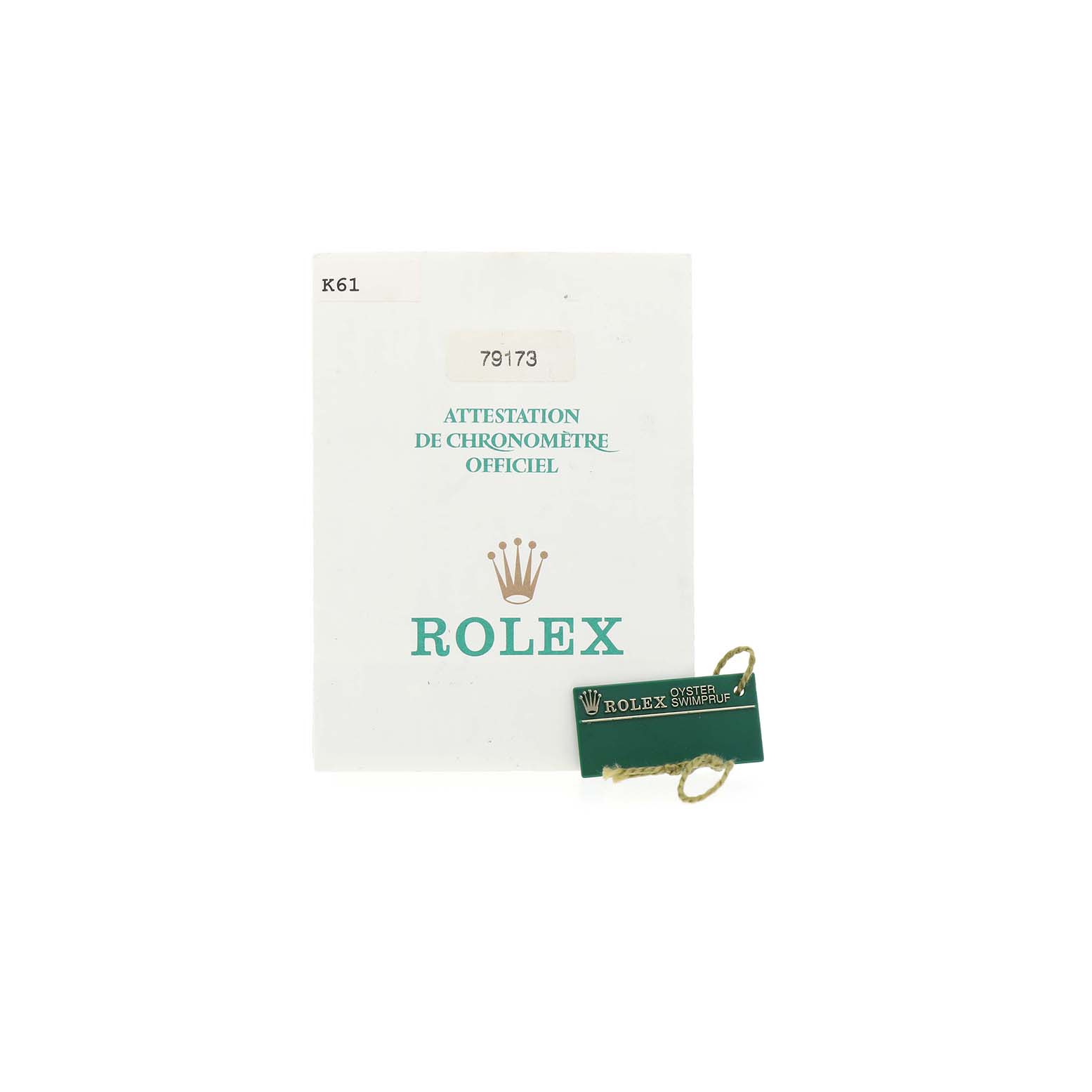 The image shows the certificate and tag accessories for a Rolex Datejust 79173 Women's Steel and Gold (two tone) Champagne Dial watch.