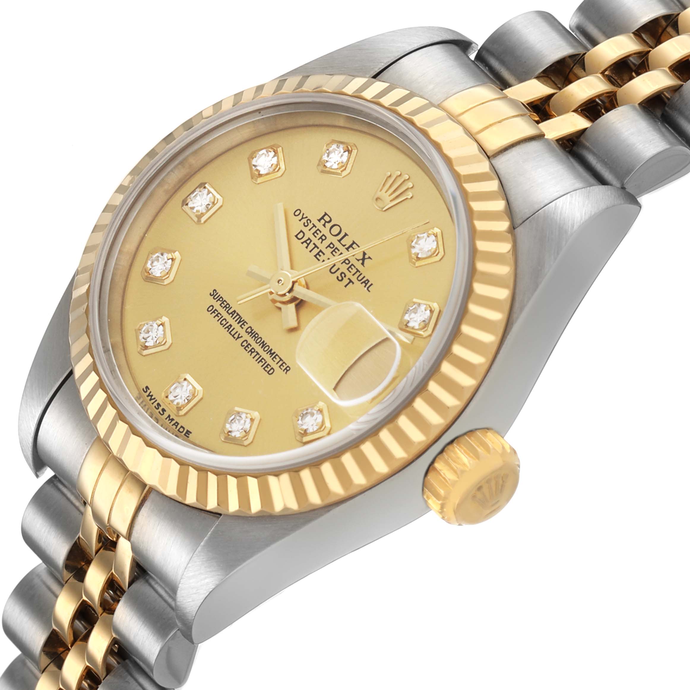 The Rolex Datejust 79173 Women's Steel and Gold (two tone) Champagne Dial watch is shown at a slight angle, featuring the dial, fluted bezel, crown, and part of the bracelet.