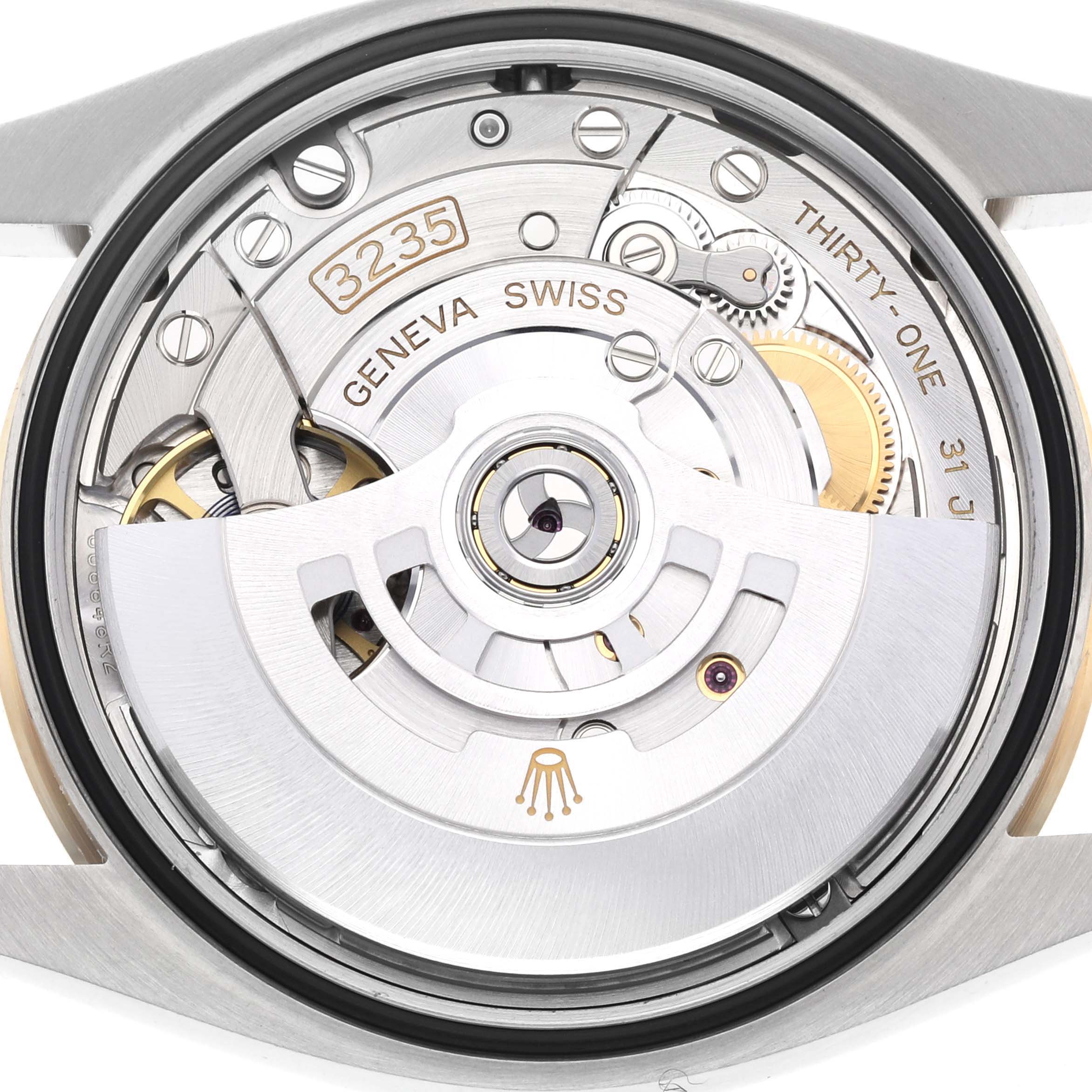 This image shows the back view of the Rolex Datejust 126233 Men's Steel and Gold (two tone) Champagne Dial 126233 Men's Steel and Gold (two tone) Champagne Dial watch, showcasing its intricate 3235 movement and mechanisms.