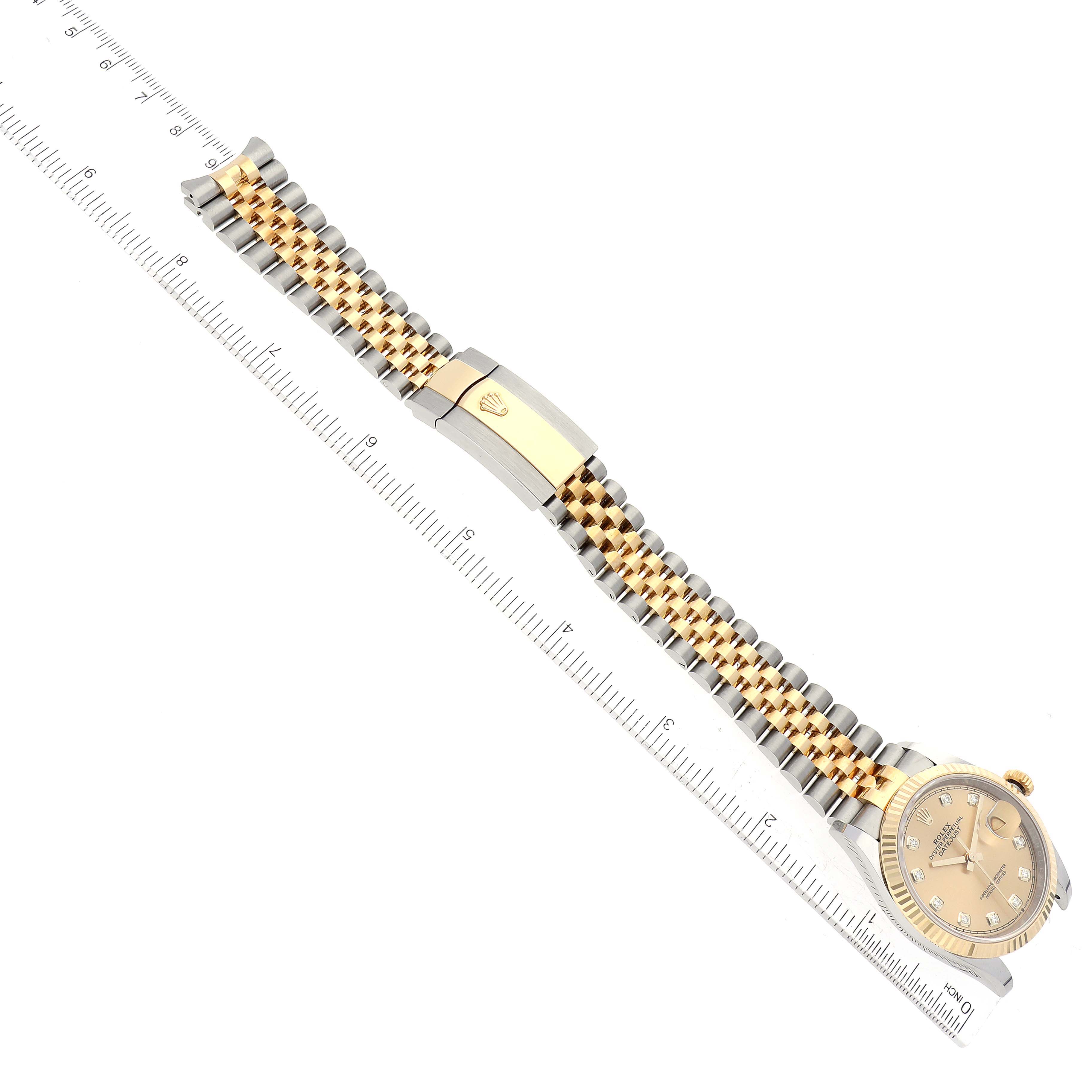 This Rolex Datejust 126233 Men's Steel and Gold (two tone) Champagne Dial 126233 Men's Steel and Gold (two tone) Champagne Dial watch is shown from a top-down angle, displaying its face, fluted bezel, and two-tone Jubilee bracelet with deployant clasp.