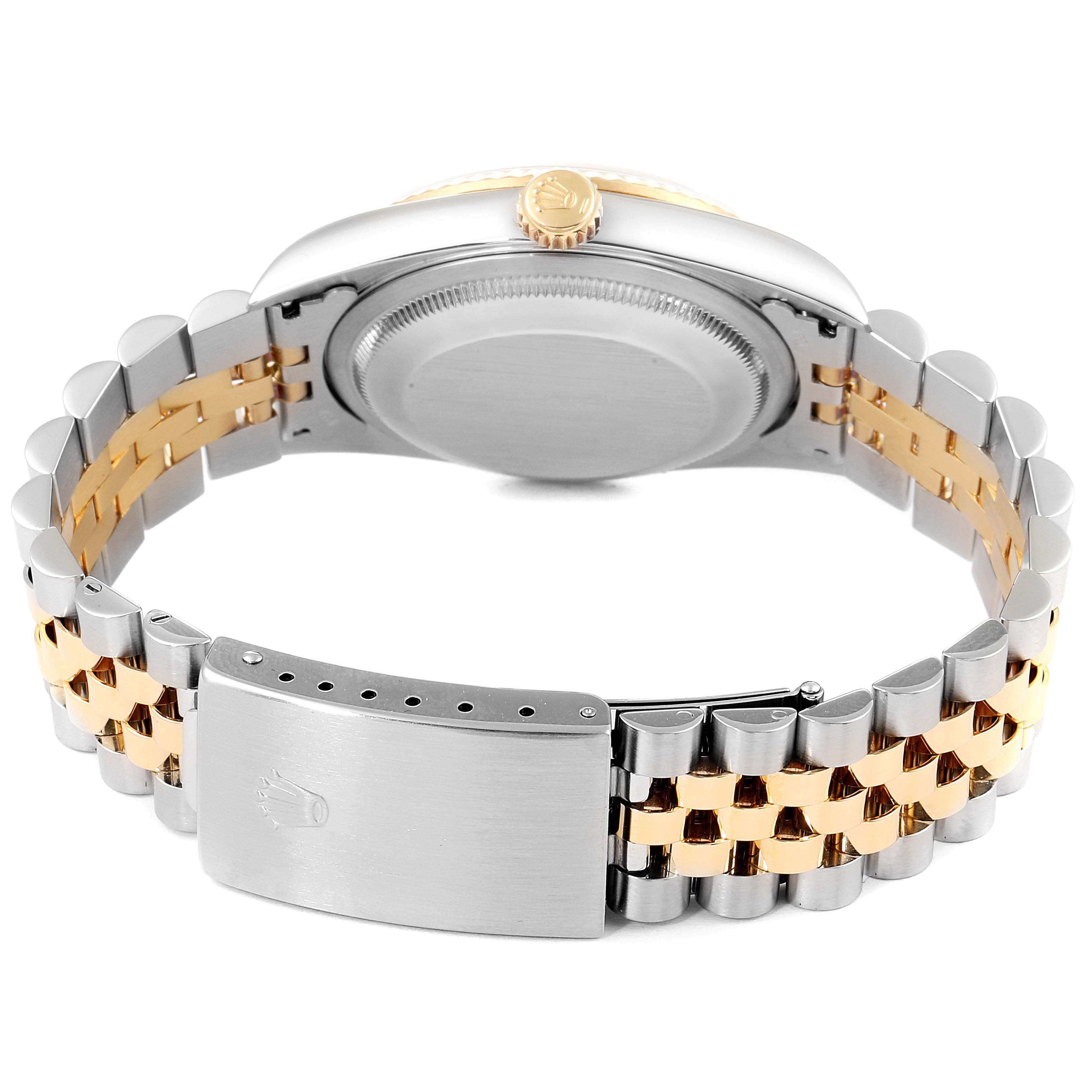 The image shows the back of a Rolex Datejust 16233 Men's Steel and Gold (two tone) Mother of Pearl Dial 16233 Men's Steel and Gold (two tone) Mother of Pearl Dial watch, including the bracelet clasp and case back.