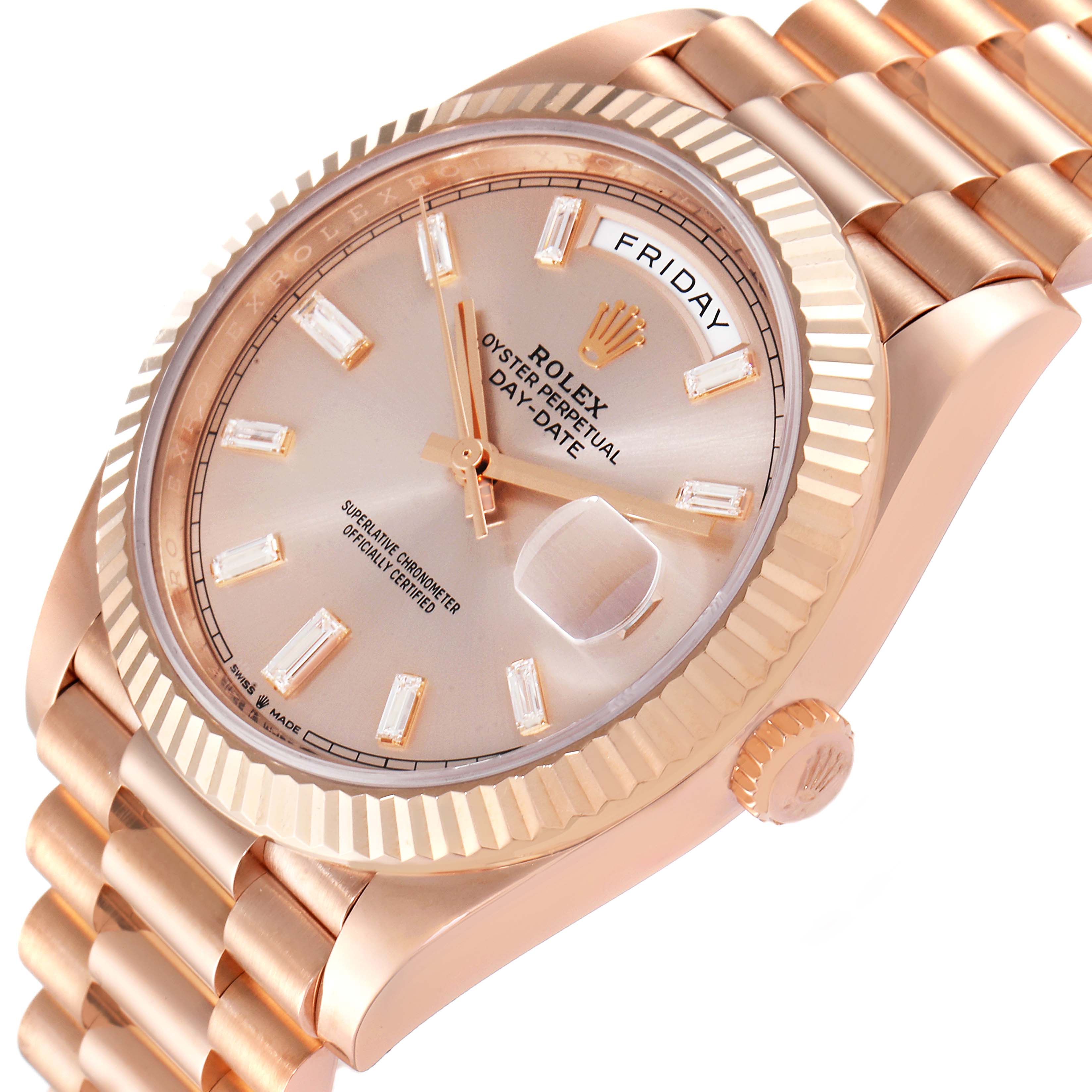 The image shows the face, crown, and part of the band of a Rolex President 228235 Men's Rose Gold Pink Dial 228235 Men's Rose Gold Pink Dial model watch at a slight angle.