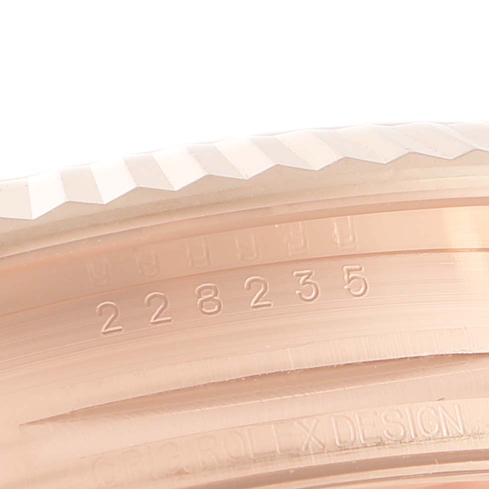 This close-up image shows the serial number engraving on the side of a President model by Rolex watch.