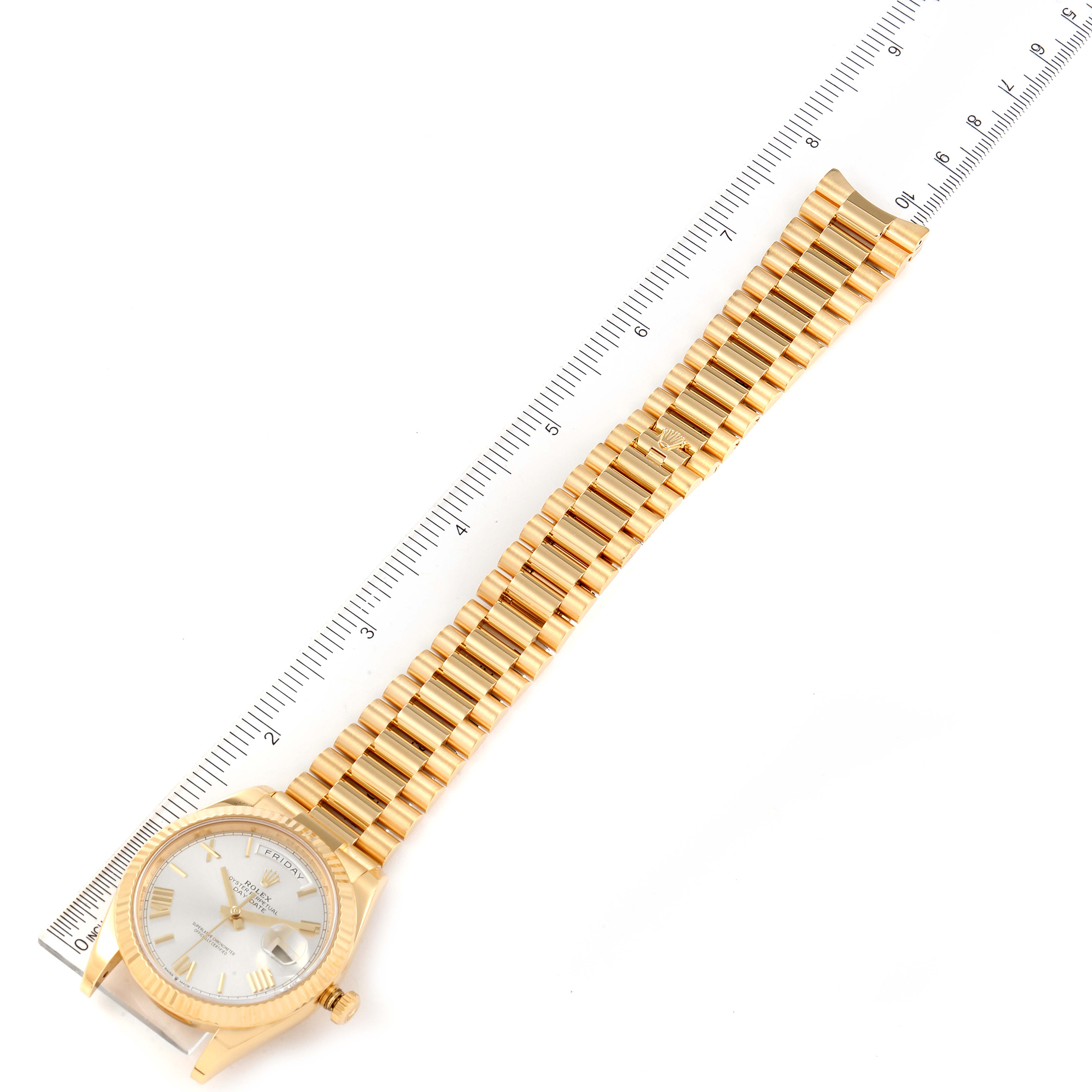 The image shows a Rolex President 218238 Men's Yellow Gold Silver Dial 218238 Men's Yellow Gold Silver Dial model watch, including the full face and gold bracelet band, laid flat beside a ruler for measurement.