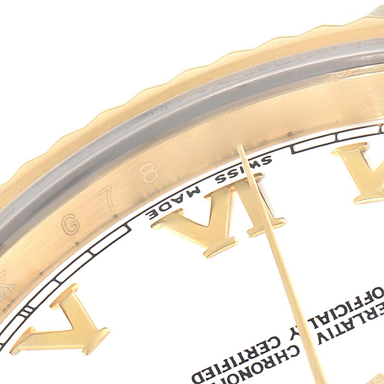 The image shows a close-up angle of the bezel, a portion of the dial, and Roman numeral markers of a Rolex President 218238 Men's Yellow Gold White Dial 218238 Men's Yellow Gold White Dial model watch.