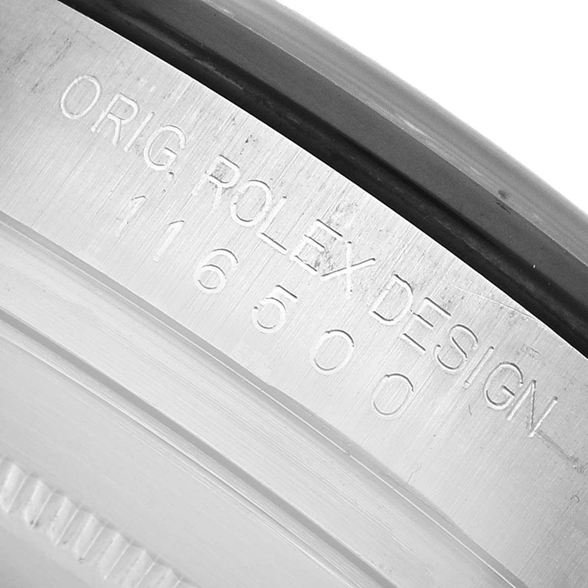 The image shows the inner rim of a Rolex Daytona 116500LN Men's Stainless Steel Yellow Dial watch, displaying the engraved text "ORIG ROLEX DESIGN 116500".