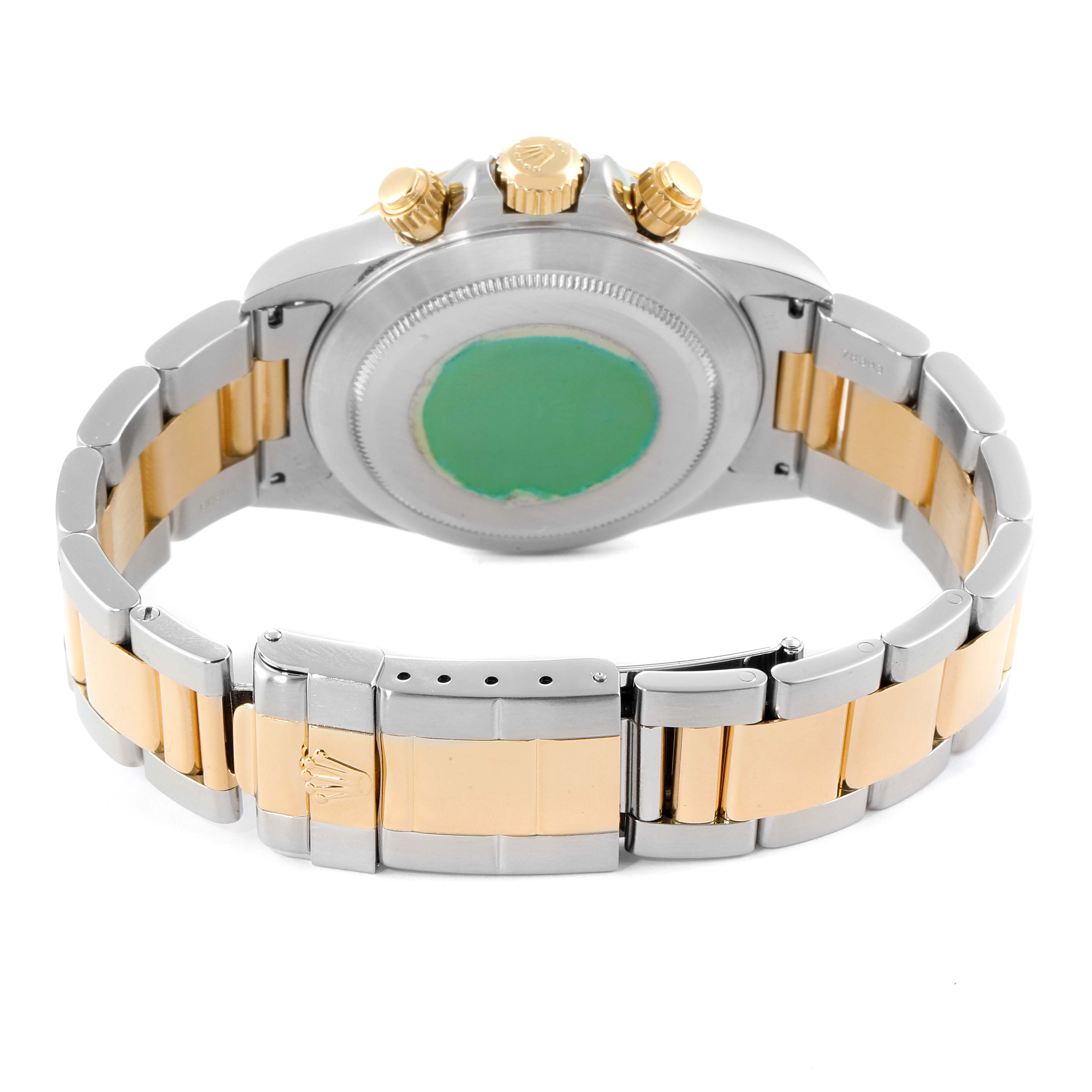 The image shows the back view of a Rolex Daytona 16523 Men
s Steel and Gold (two tone) Champagne Dial 16523 Men
s Steel and Gold (two tone) Champagne Dial watch, highlighting its case back, crown, and bracelet.