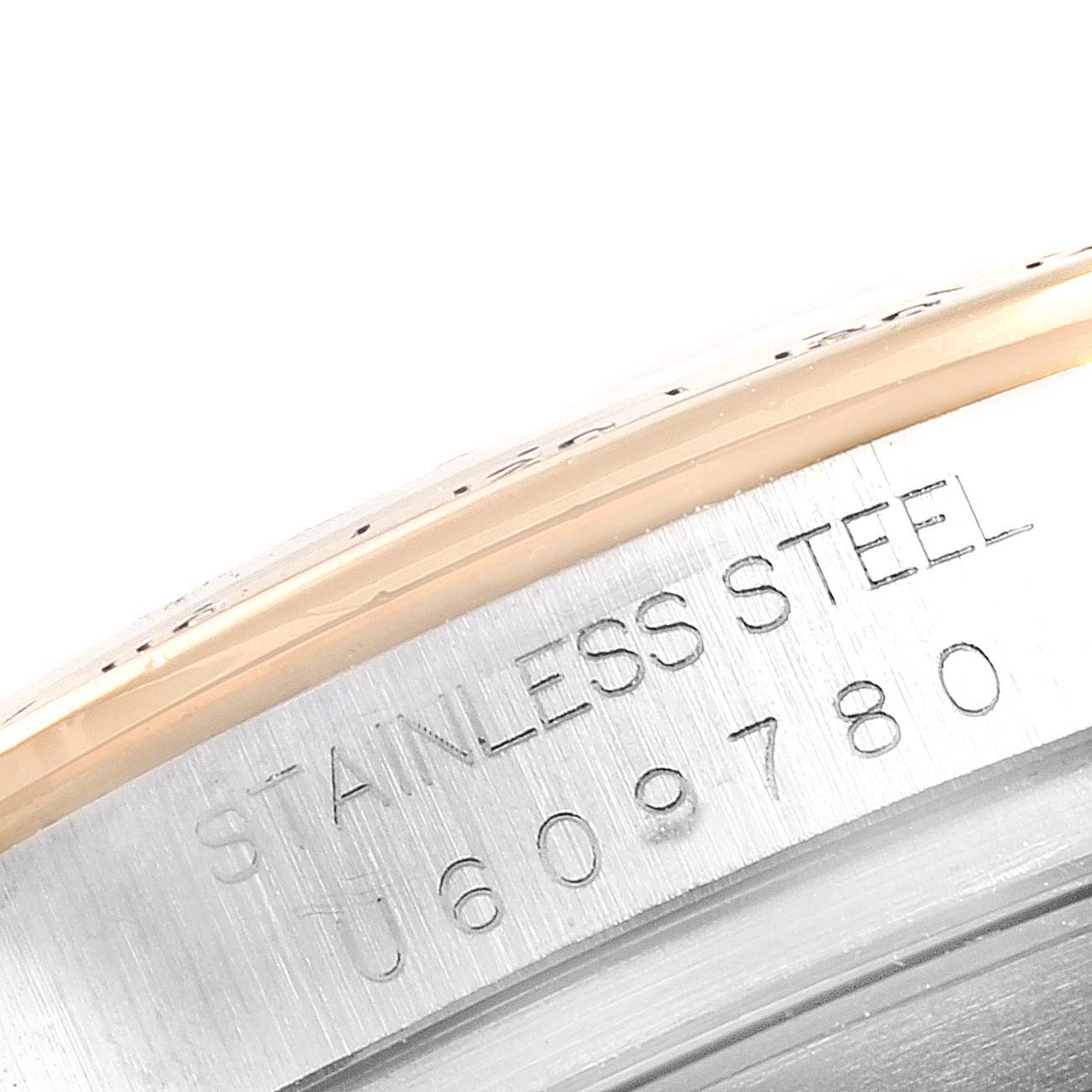 This close-up shot of a Rolex Daytona 16523 Men
s Steel and Gold (two tone) Champagne Dial 16523 Men
s Steel and Gold (two tone) Champagne Dial watch features the engraved stainless steel case back.