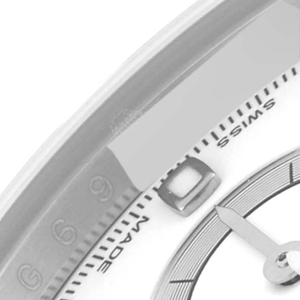 The image shows a close-up angle of the Rolex Daytona 116520 Men's Stainless Steel White Dial 116520 Men's Stainless Steel White Dial watch, focusing on the dial with the "Swiss Made" inscription and part of the indices.