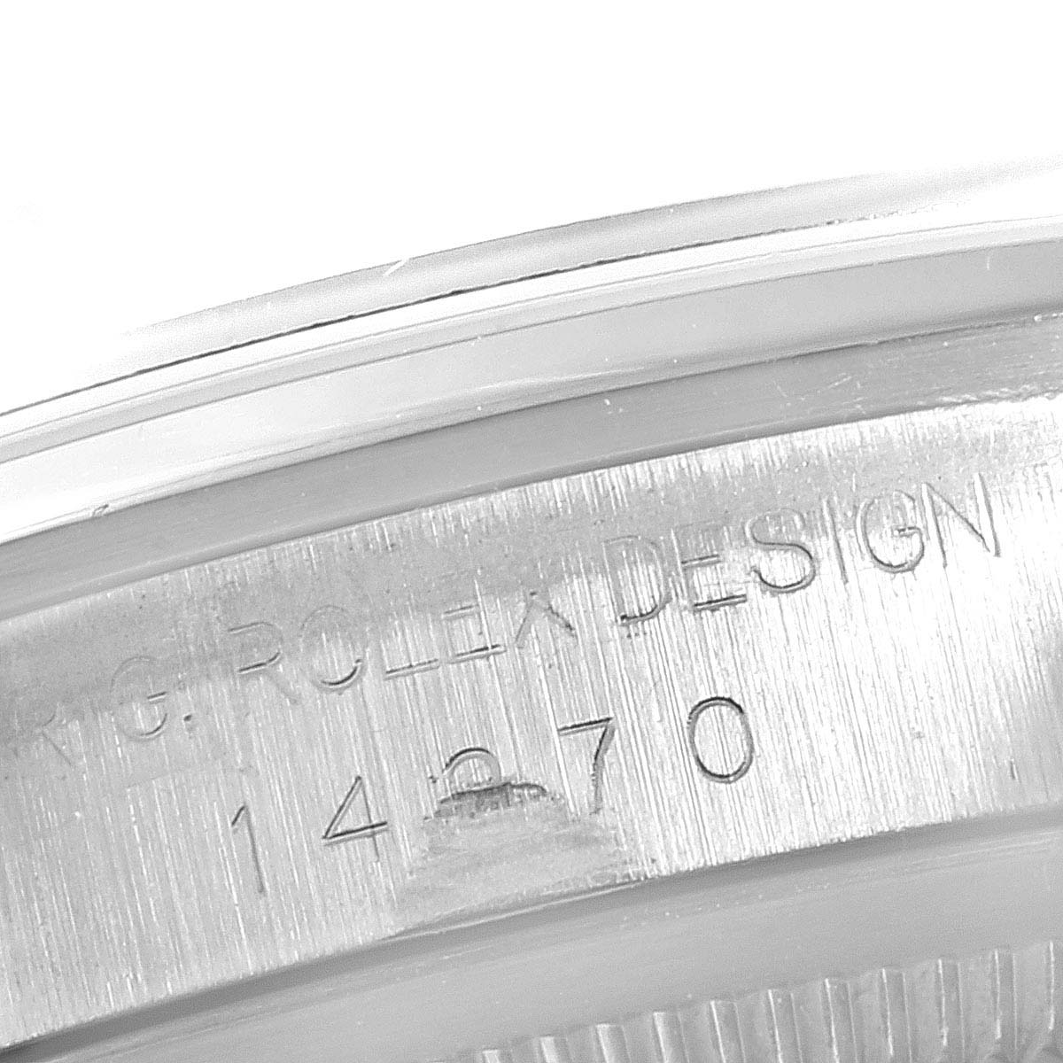 This image shows the side edge of the case with "Rolex Design" and model number engraved on a Rolex Explorer 14270 Men
s Stainless Steel Black Dial 14270 Men
s Stainless Steel Black Dial watch.