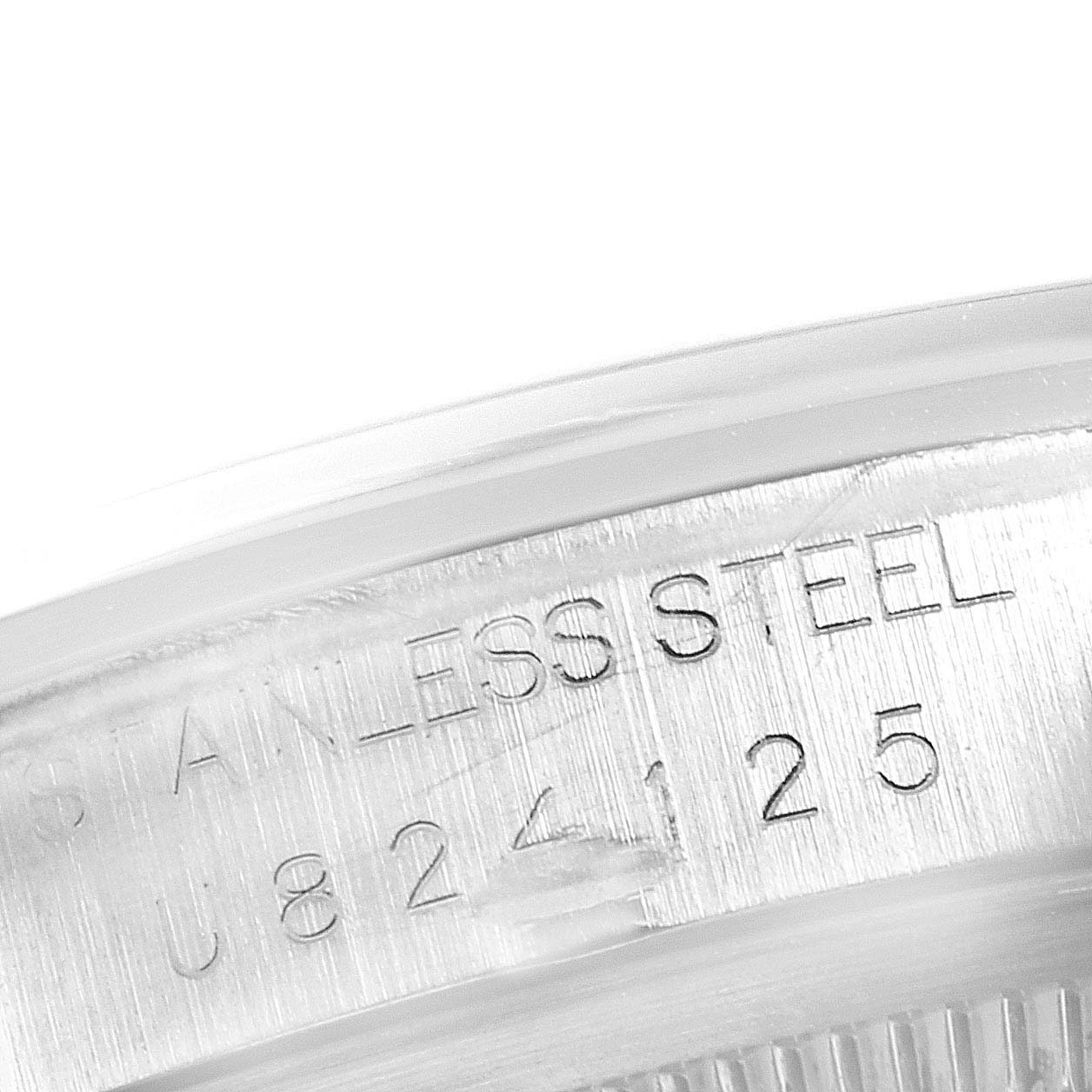 This image shows a close-up of the case back of a Rolex Explorer 14270 Men
s Stainless Steel Black Dial 14270 Men
s Stainless Steel Black Dial, highlighting the engraved text "STAINLESS STEEL."