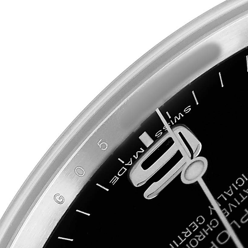 The image shows a close-up of the dial, hands, and bezel of a Rolex Explorer 214270 Men's Stainless Steel Black Dial watch.