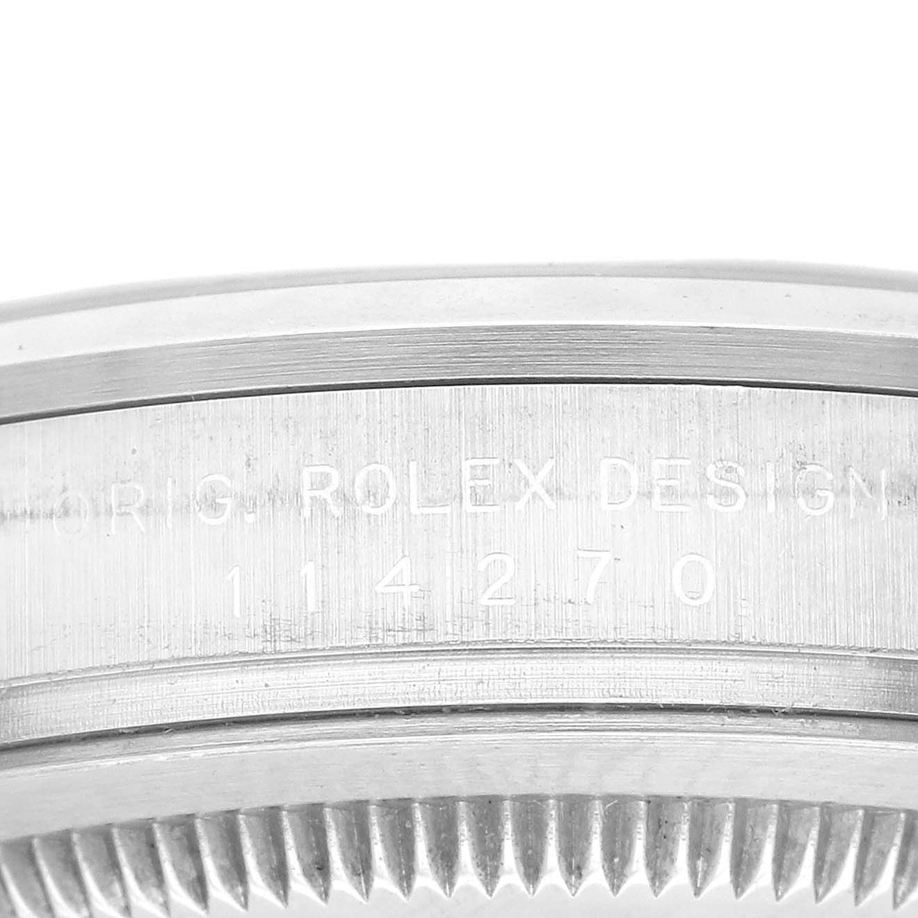 This close-up angle shows the side case of a Rolex Explorer 114270 Men
s Stainless Steel Black Dial 114270 Men
s Stainless Steel Black Dial watch, featuring its model number and "Rolex Design" engraving.