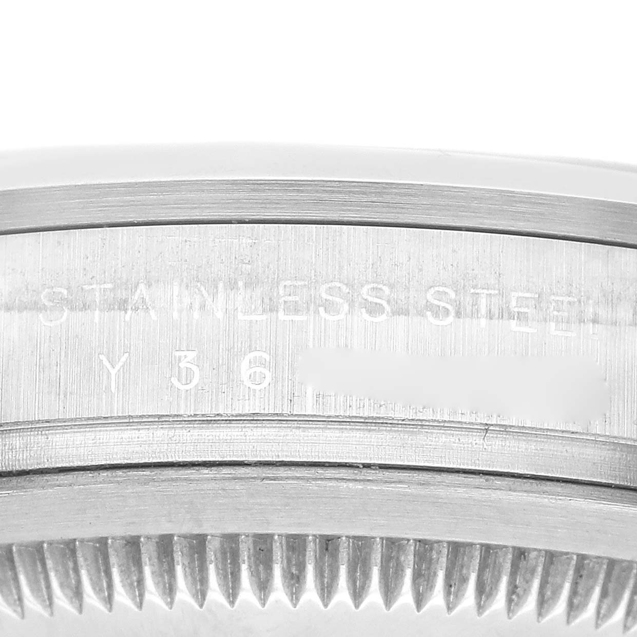 The image shows a close-up of the side of the case with engravings and the bezel teeth of the Rolex Explorer 114270 Men
s Stainless Steel Black Dial 114270 Men
s Stainless Steel Black Dial model.