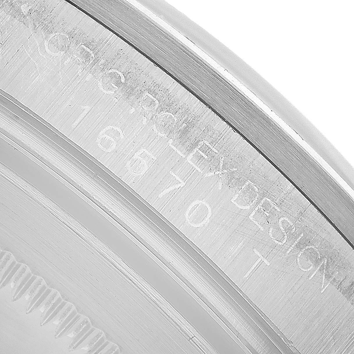 The image shows a close-up angle of the Rolex Explorer 16570 Men's Stainless Steel White Dial model's engraved inner bezel and case edge.