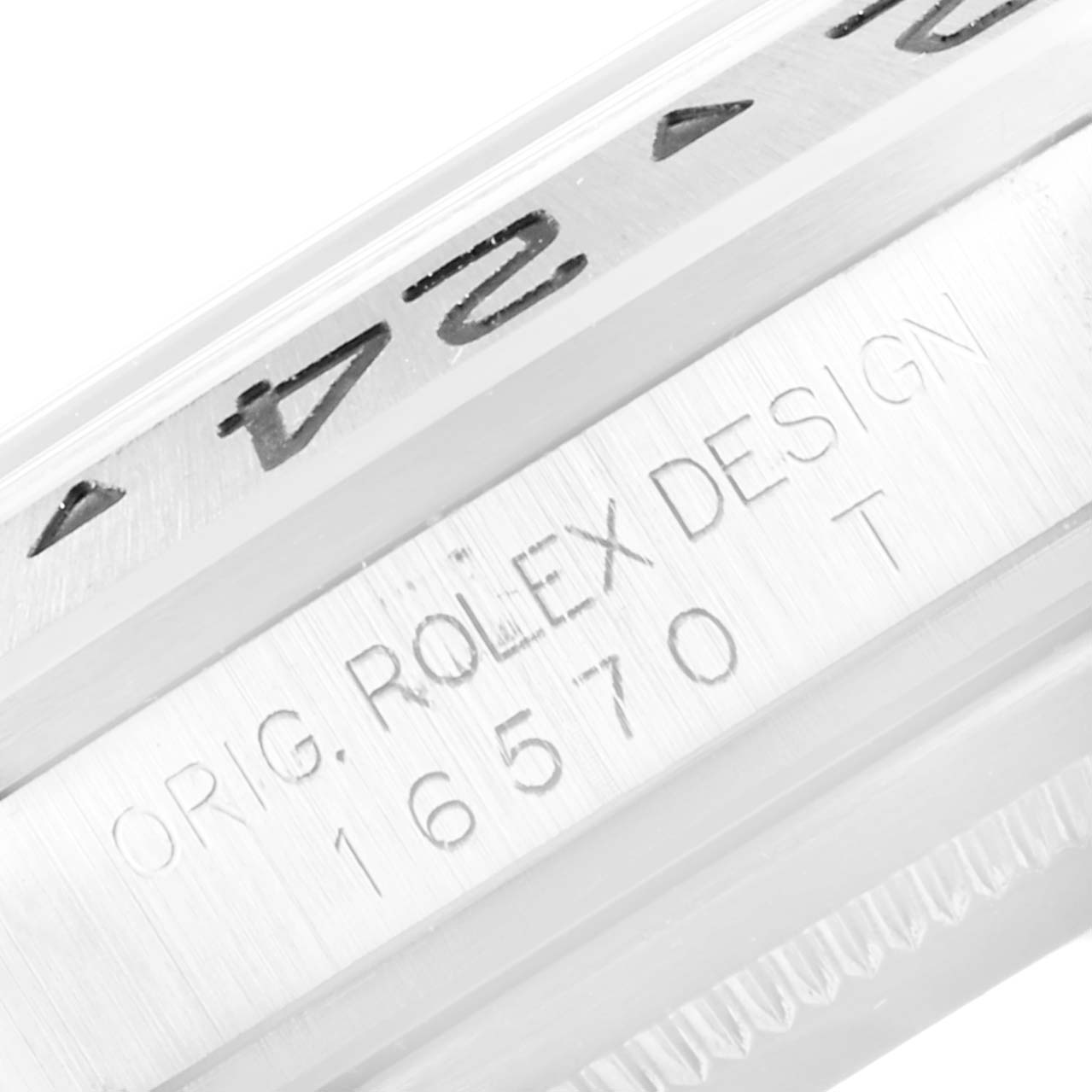 The image shows a close-up of the bezel and engraved casing of a Rolex Explorer 16570 Men's Stainless Steel White Dial 16570 Men's Stainless Steel White Dial model watch.