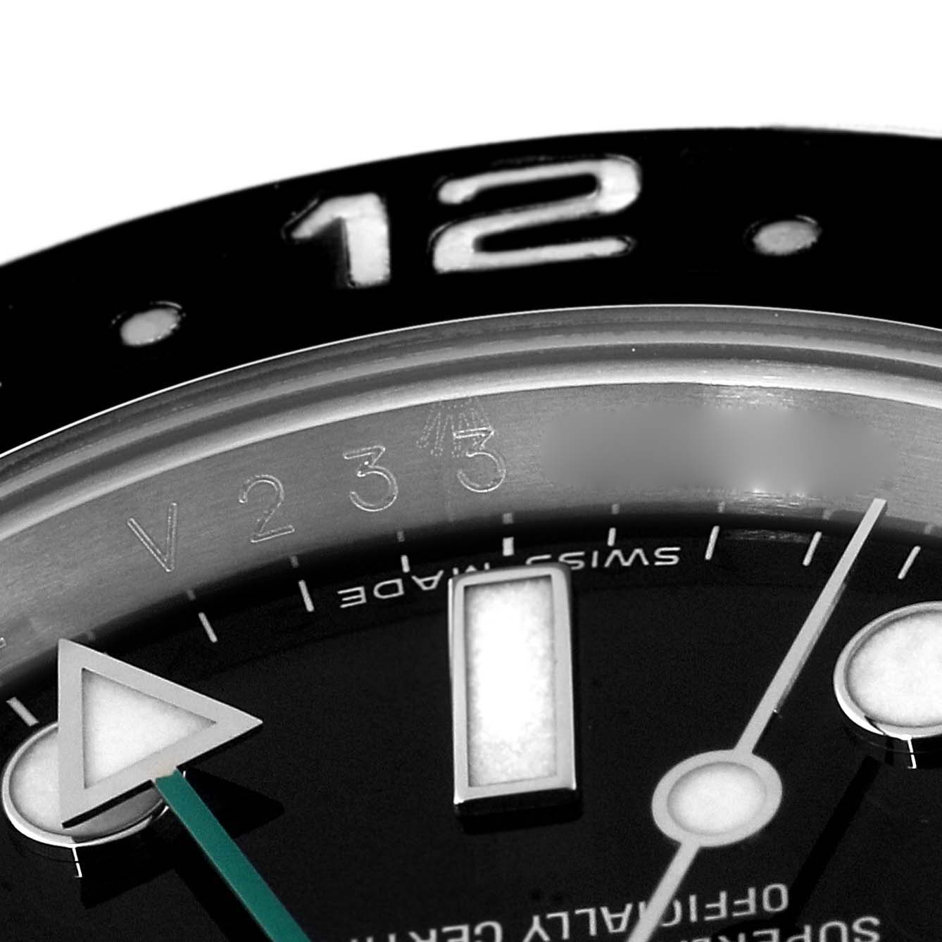 The image shows a close-up of the bezel, dial, and hour markers of a Rolex GMT-Master 116710 Men
s Stainless Steel Black Dial 116710 Men
s Stainless Steel Black Dial watch, focusing on the 12 o
clock position.