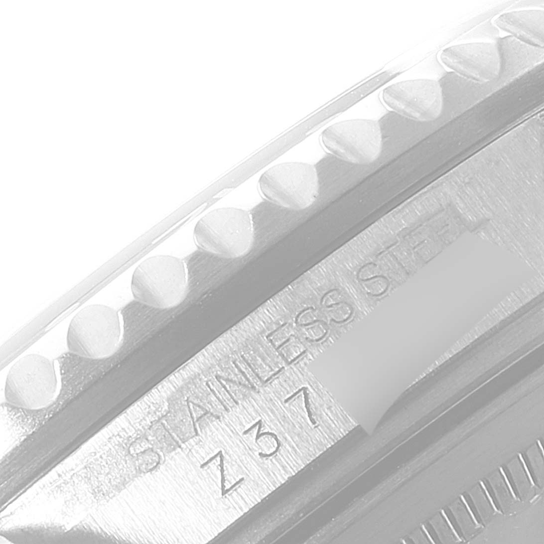 The image shows a close-up angle of the bezel and part of the case of a stainless steel Rolex GMT-Master 16710 Men
s Stainless Steel Black Dial 16710 Men
s Stainless Steel Black Dial watch.