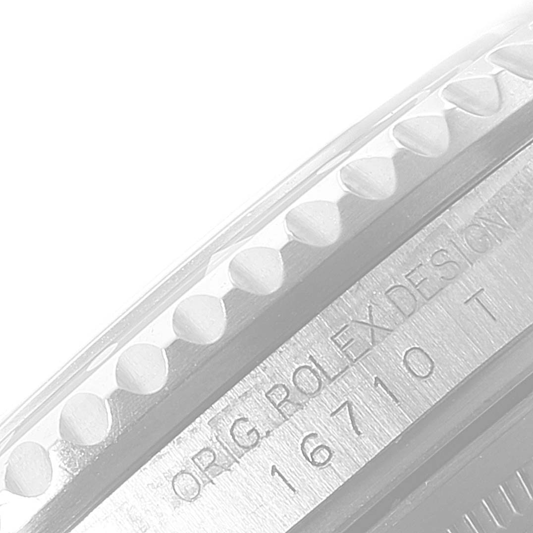 This image shows a close-up of the bezel and case of the Rolex GMT-Master 16710 Men
s Stainless Steel Black Dial 16710 Men
s Stainless Steel Black Dial watch, highlighting the design and model number 16710.