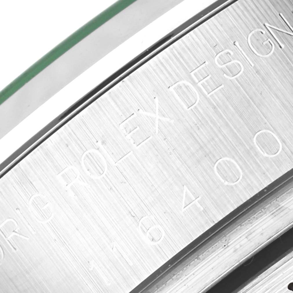 This close-up image shows the engraved case side of a Rolex Milgauss 116400GV Men's Stainless Steel Blue Dial 116400GV Men's Stainless Steel Blue Dial watch with the model number visible.