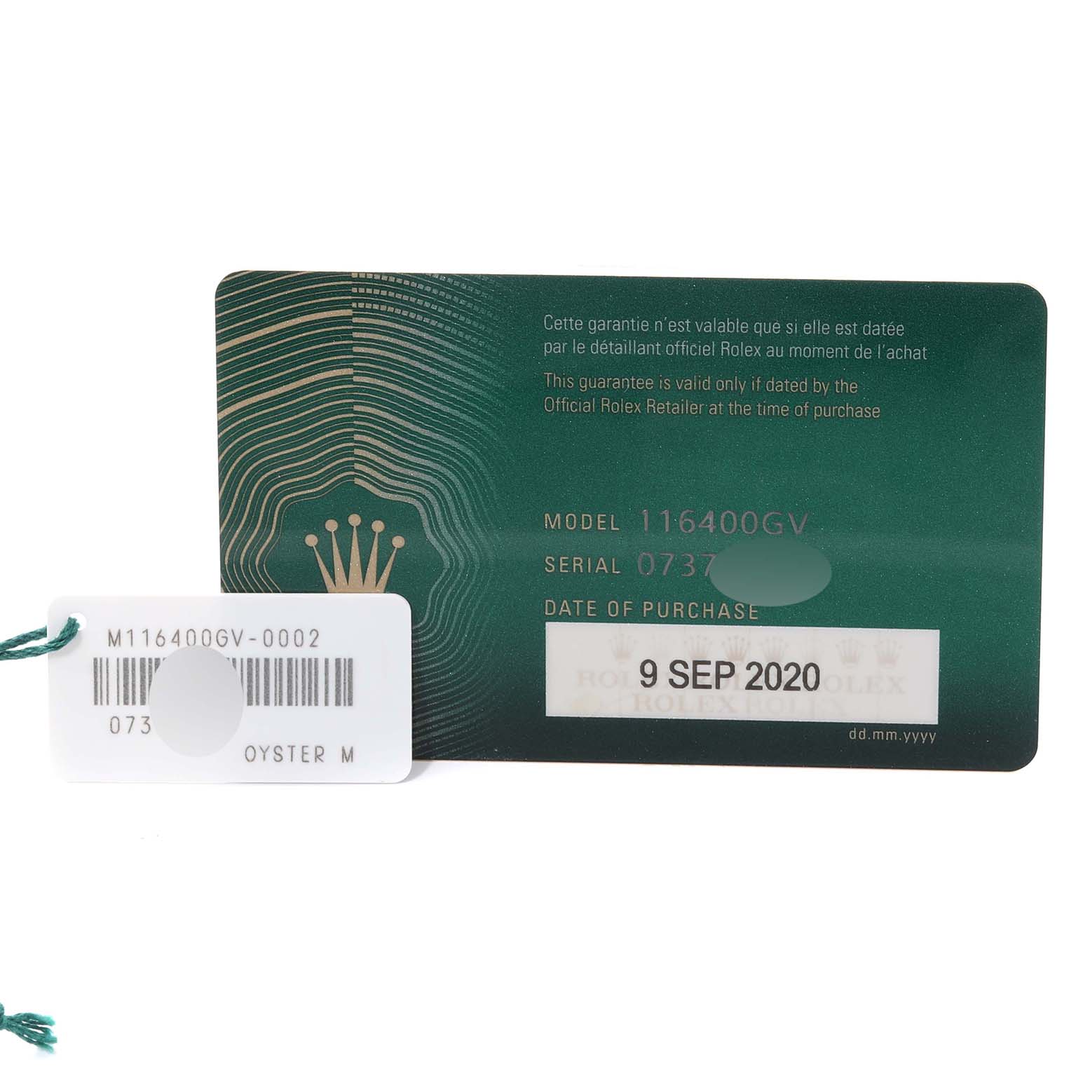 This image shows a guarantee card and tag for a Rolex Milgauss 116400GV Men's Stainless Steel Blue Dial 116400GV Men's Stainless Steel Blue Dial model 116400GV watch.