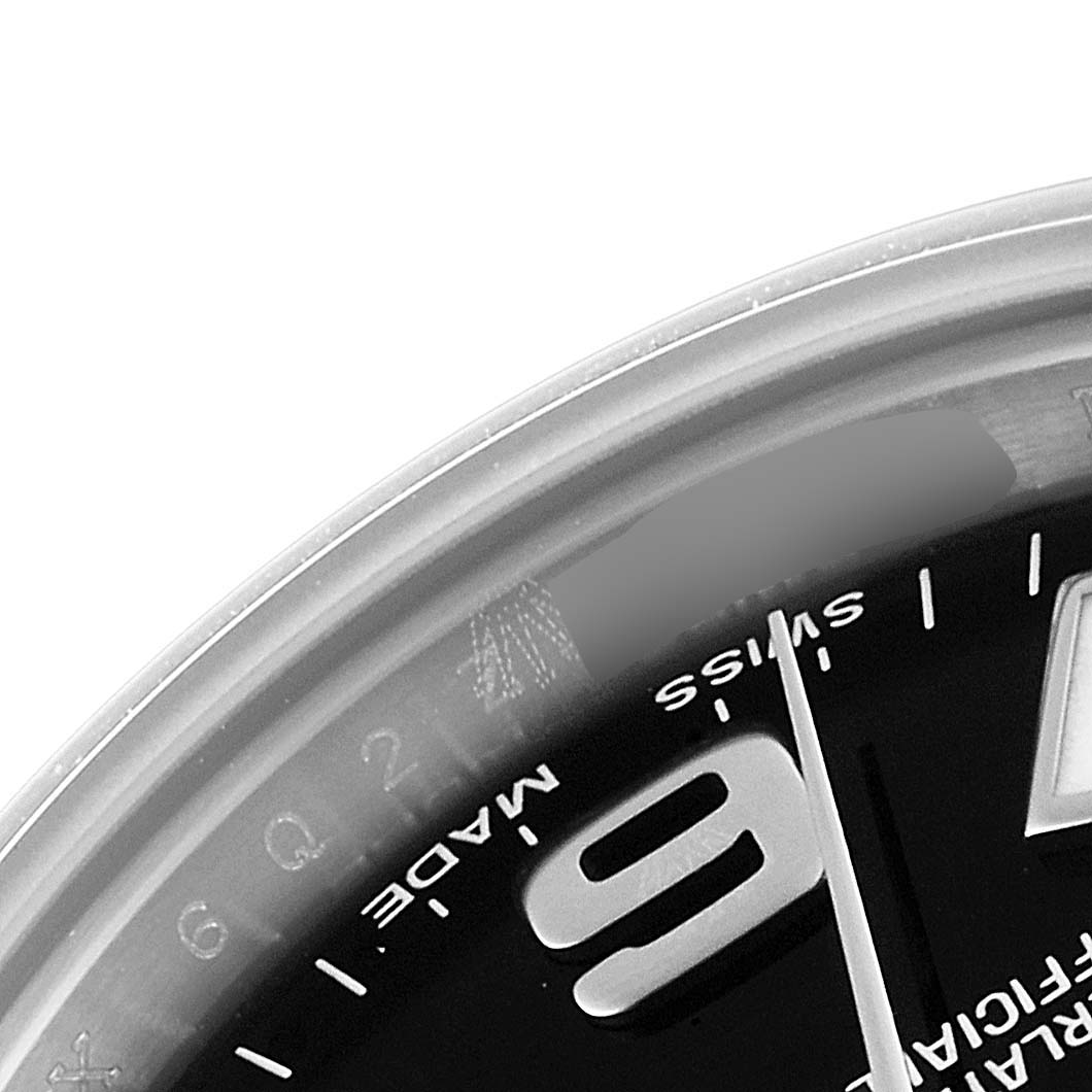 The image shows a close-up of the dial focusing on the "9" numeral, "Swiss Made" text, and a portion of the bezel of the Rolex Oyster Perpetual 176200 Women's Stainless Steel Black Dial 176200 Women's Stainless Steel Black Dial watch.