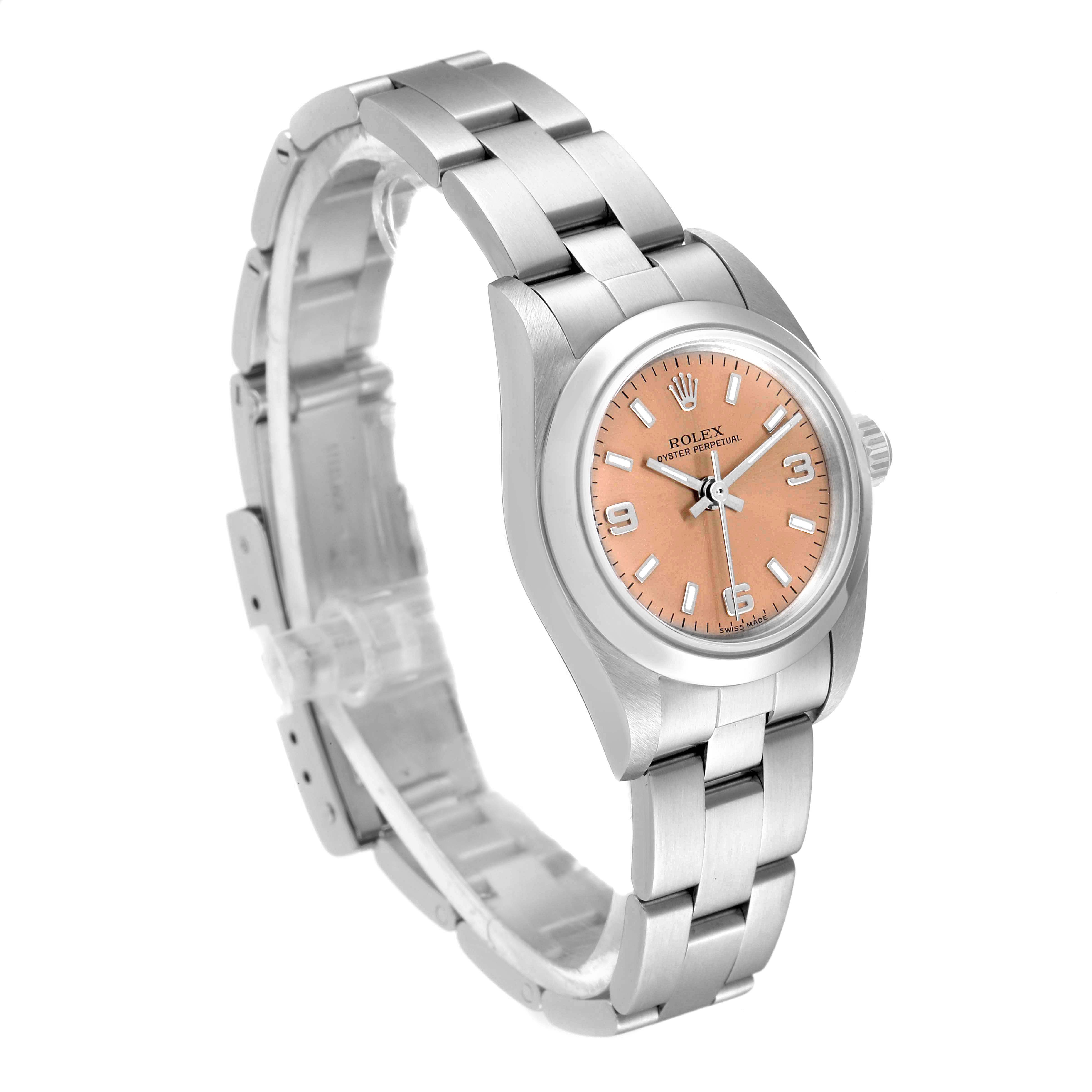 The image shows a Rolex Oyster Perpetual 76080 Women's Stainless Steel Pink Dial 76080 Women's Stainless Steel Pink Dial watch at a three-quarter angle, highlighting the face, bezel, and stainless steel bracelet.