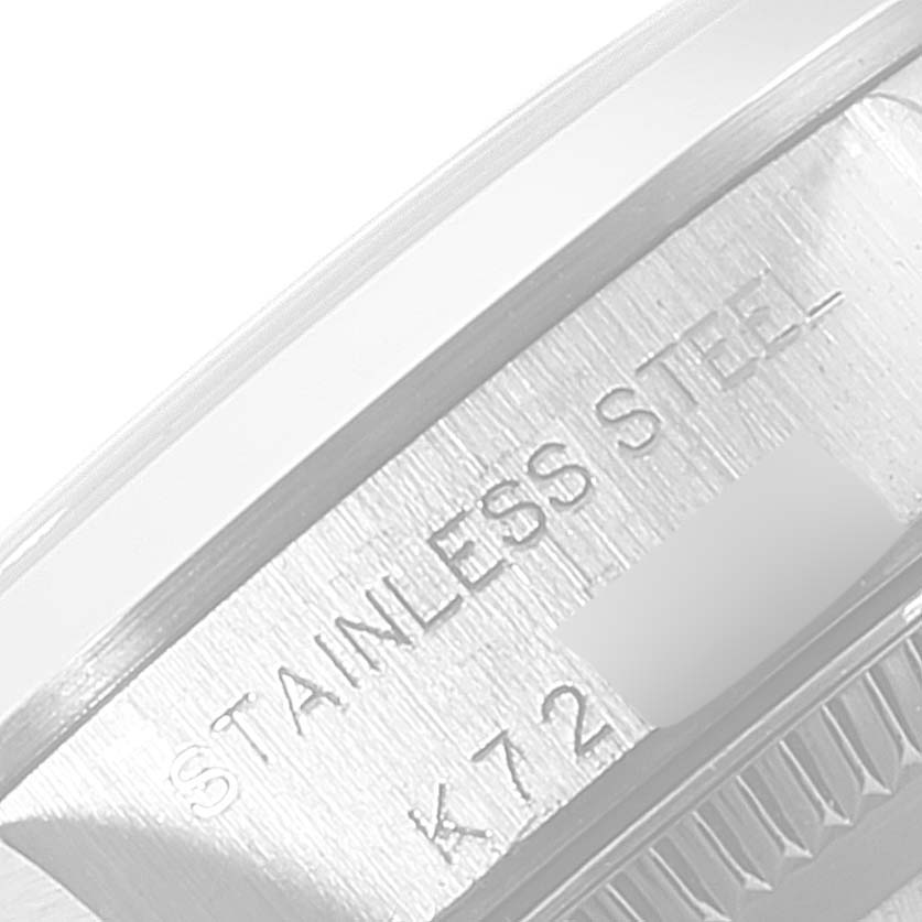 This image shows a close-up of the side of a Rolex Oyster Perpetual 76080 Women's Stainless Steel Pink Dial 76080 Women's Stainless Steel Pink Dial watch, highlighting its stainless steel case.