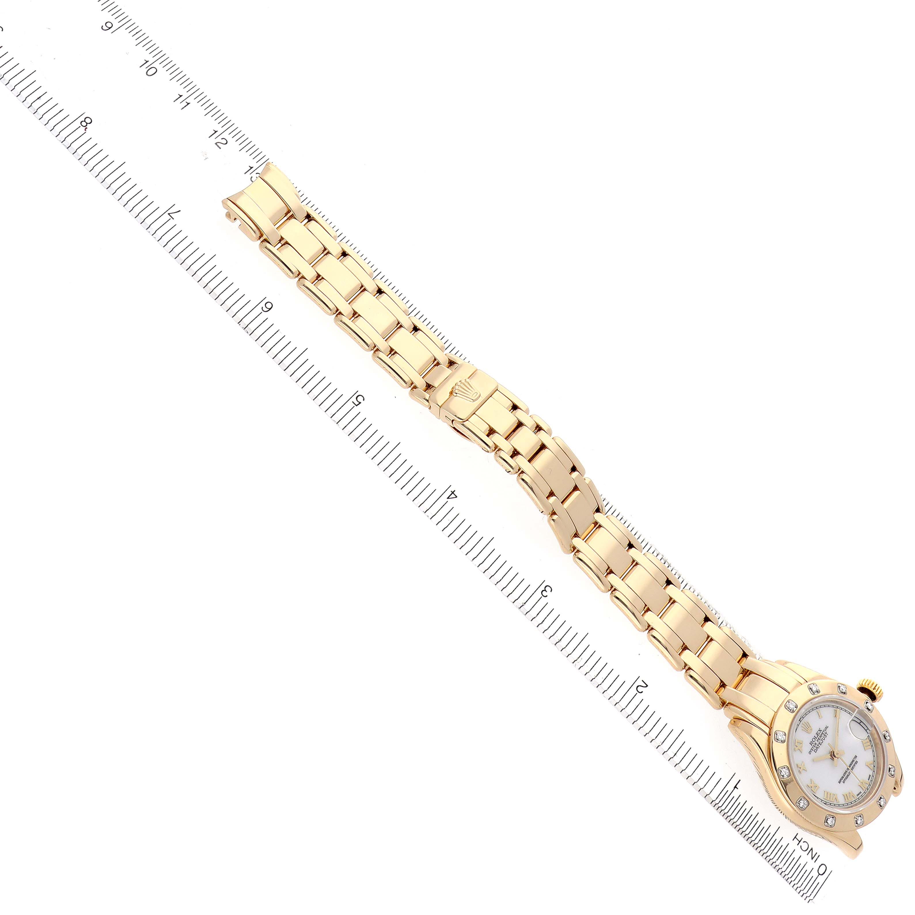 The Rolex Pearlmaster 69318 Women
s Yellow Gold White Dial 69318 Women
s Yellow Gold White Dial watch is shown from an overhead view, displaying the entire band and watch face.