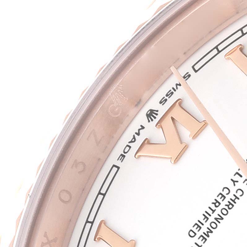 This image shows a close-up of the dial and bezel of a Rolex President 128235 Men's Rose Gold White Dial 128235 Men's Rose Gold White Dial model watch, focusing on the Roman numeral markers and "Swiss Made" text.