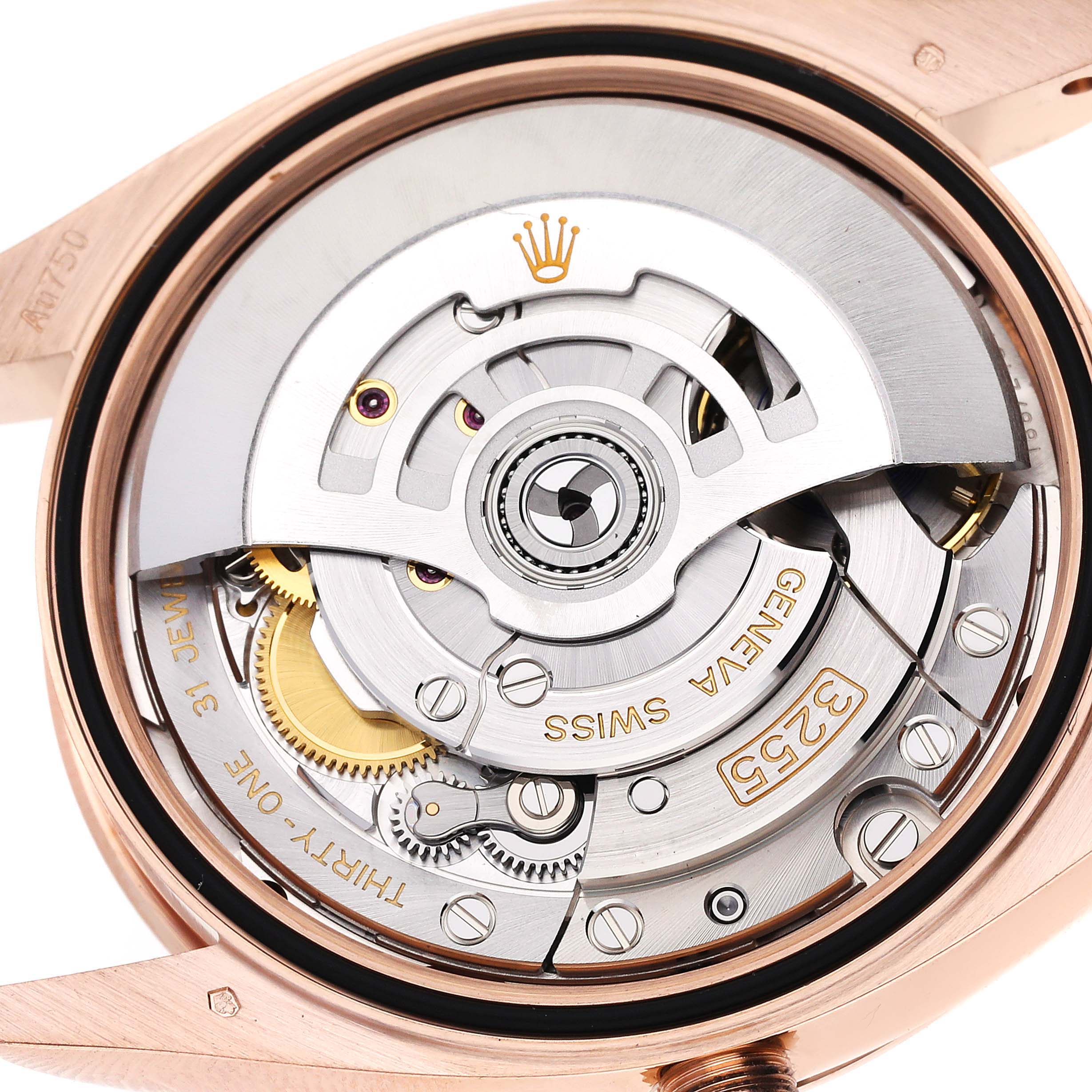 This image shows a close-up view of the movement mechanism inside a Rolex President 128235 Men's Rose Gold White Dial 128235 Men's Rose Gold White Dial watch.