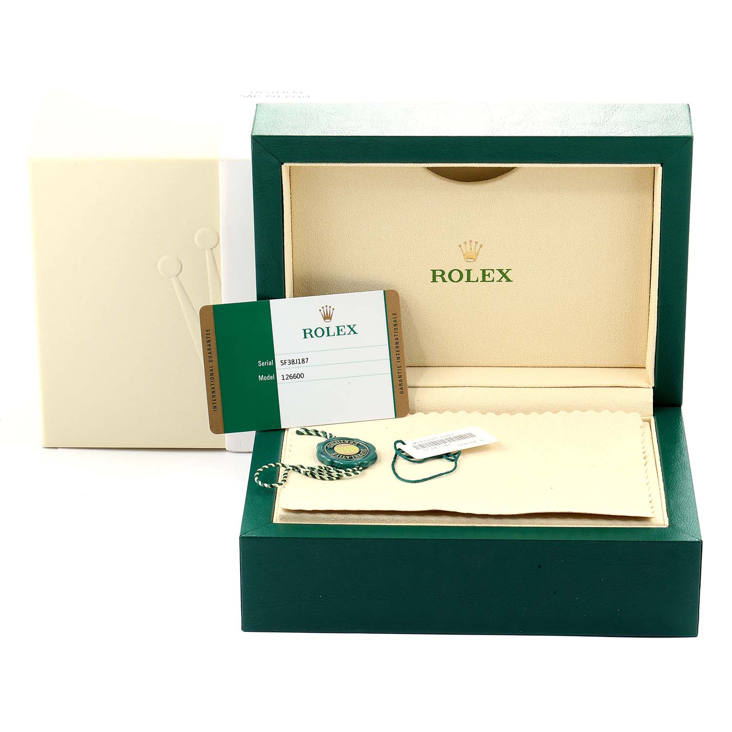 The image shows the packaging, warranty card, and accessories for a Rolex Sea-Dweller 126600 Men
s Stainless Steel Black Dial 126600 Men
s Stainless Steel Black Dial watch, viewed from the front.