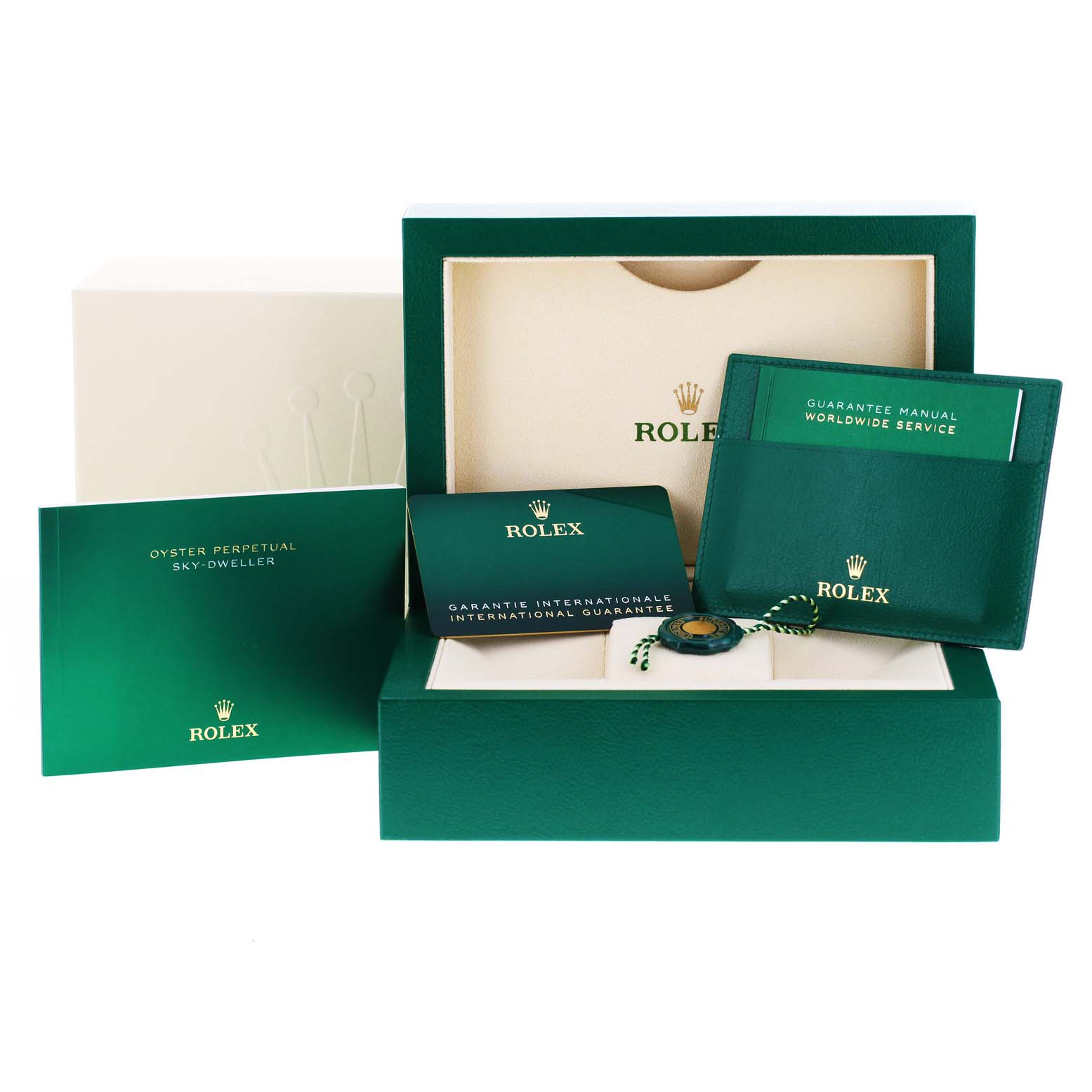 The image shows the packaging for a Rolex Sky-Dweller 326934 Men's Stainless Steel Blue Dial 326934 Men's Stainless Steel Blue Dial, including manuals, guarantee card, and the storage box.