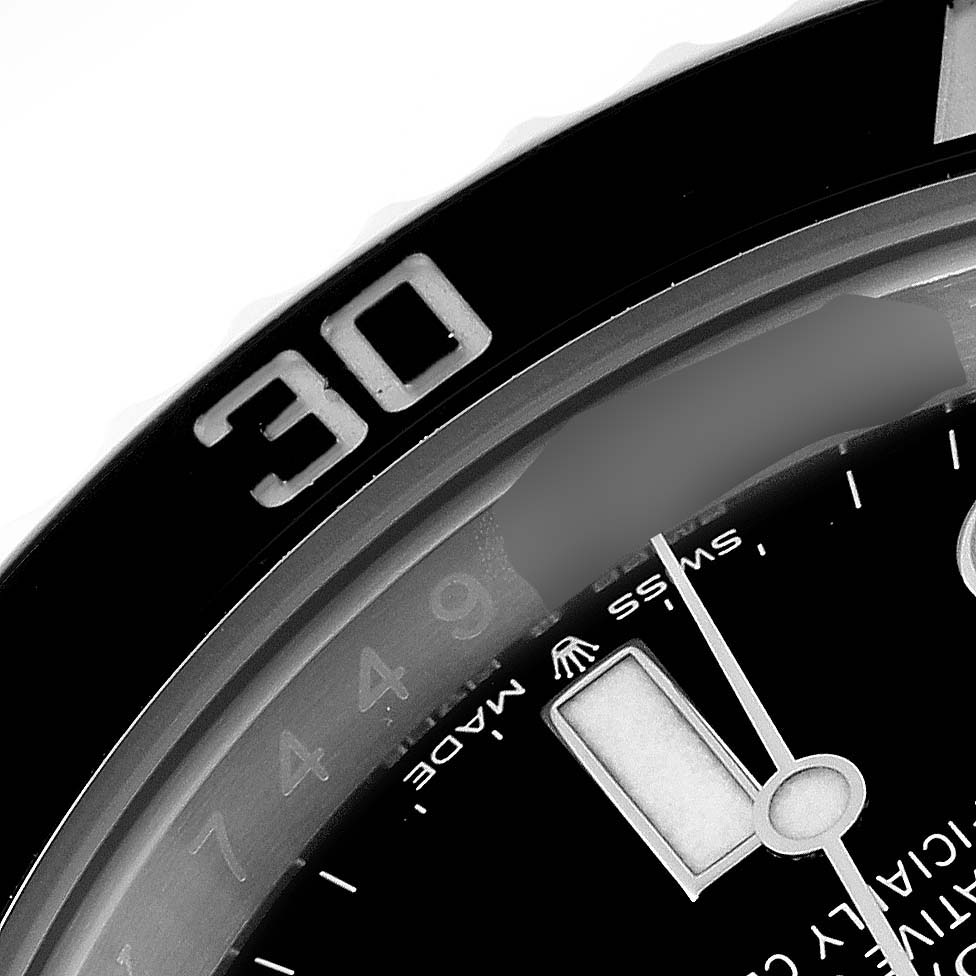The image shows a close-up of the bezel and part of the dial of a Rolex Submariner 126610LN Men
s Stainless Steel Black Dial 126610LN Men
s Stainless Steel Black Dial watch.