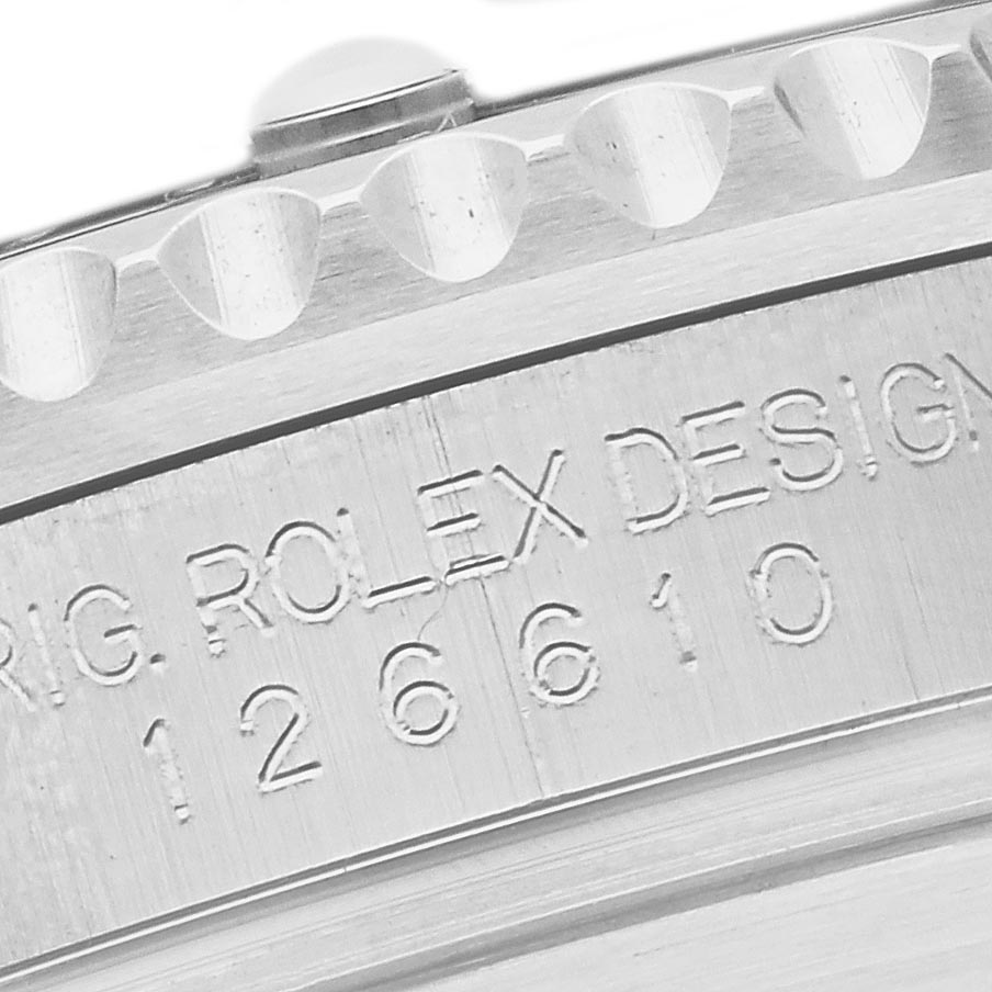 The image shows a close-up angle of the Rolex Submariner 126610LN Men's Stainless Steel Black Dial 126610LN Men's Stainless Steel Black Dial's engraved case with bezel details.