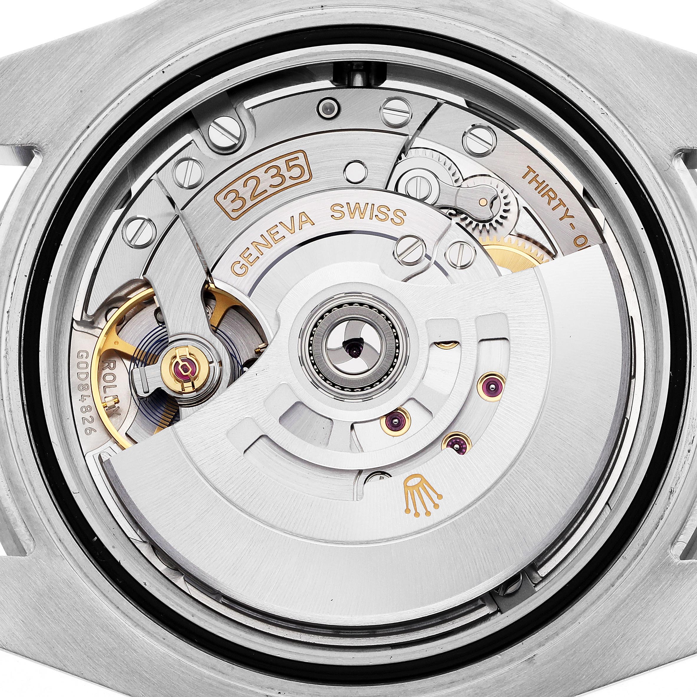 The image shows the movement of a Rolex Submariner 126610LN Men's Stainless Steel Black Dial 126610LN Men's Stainless Steel Black Dial, highlighting the intricate gears and rotor from the back.