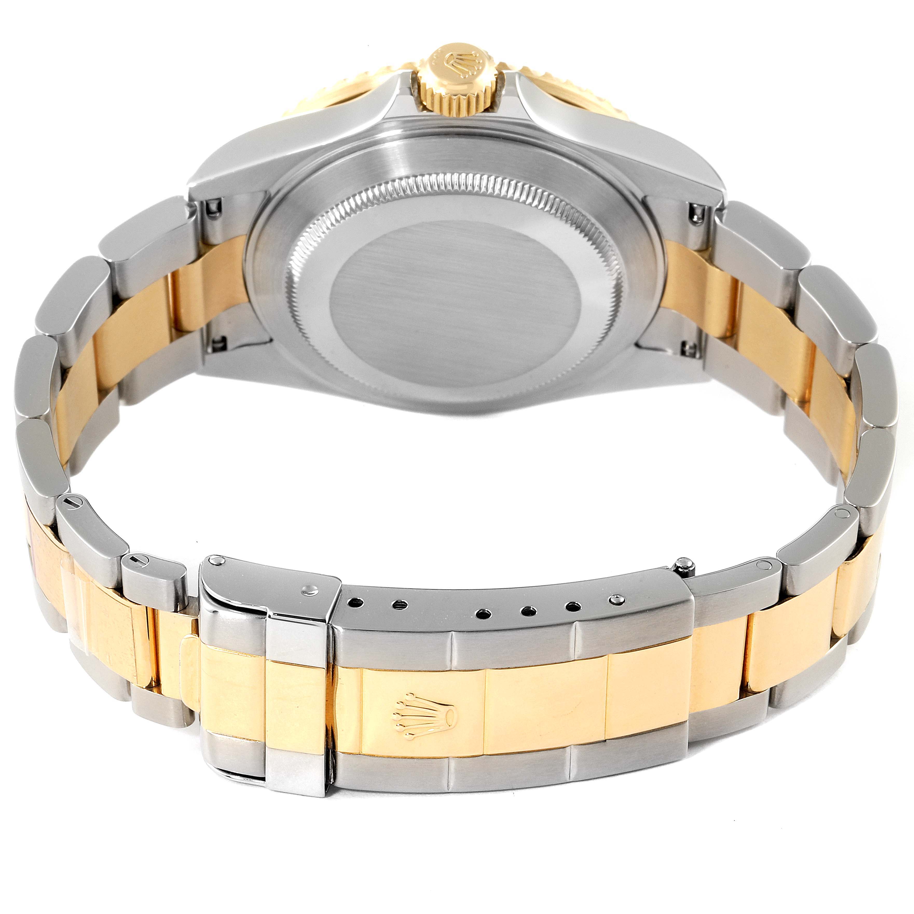 The image shows the back view of a Rolex Submariner 16613 Men
s Steel and Gold (two tone) Blue Dial 16613 Men
s Steel and Gold (two tone) Blue Dial watch, highlighting its case, bracelet, and clasp.