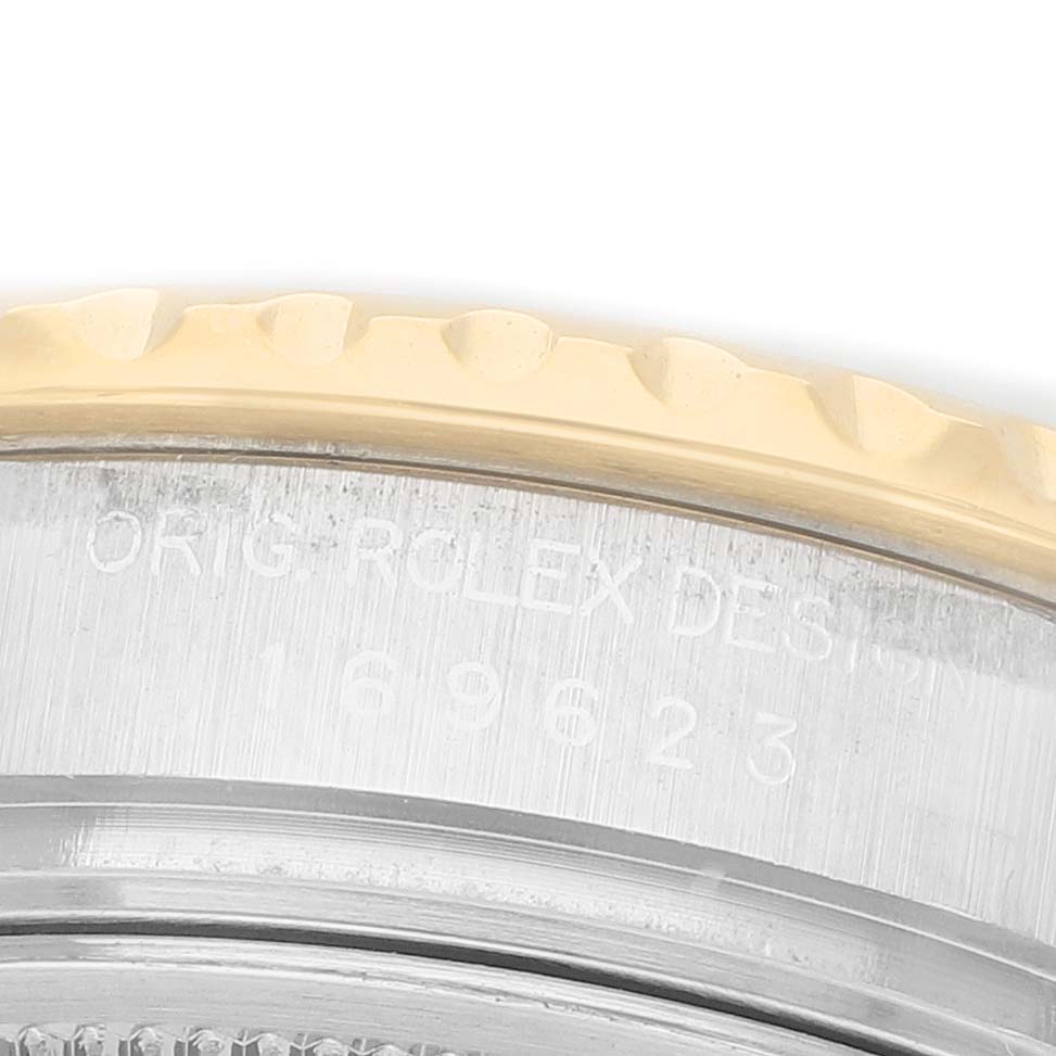 The image shows a close-up of the bezel and part of the case of a Rolex Yacht-Master 169623 Women's Steel and Gold (two tone) White Dial watch.