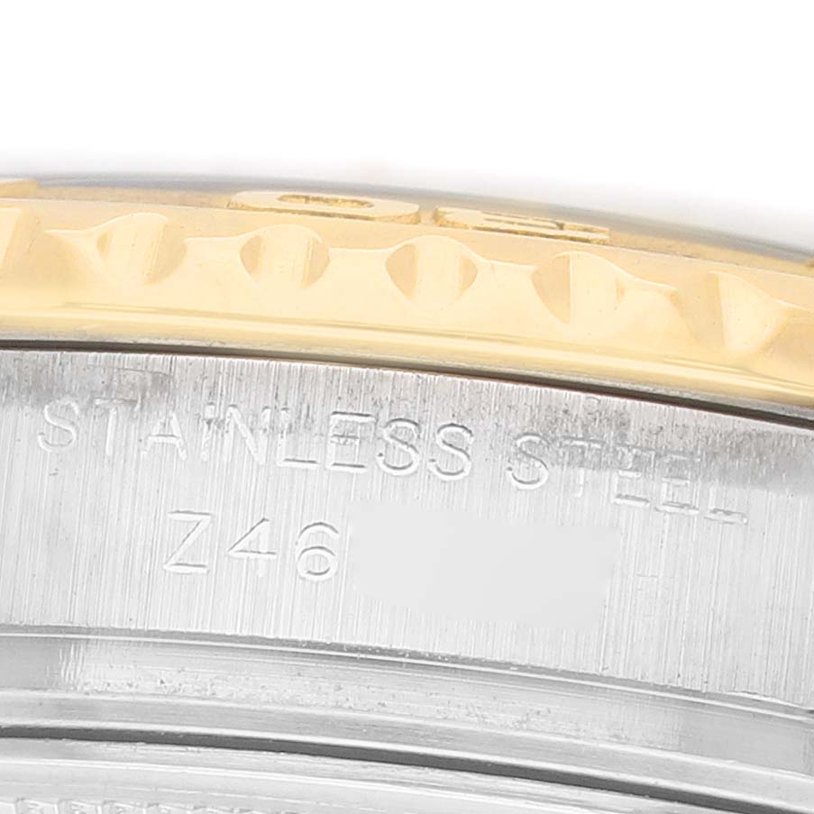 The close-up image shows the side of a Rolex Yacht-Master 169623 Women's Steel and Gold (two tone) White Dial watch, focusing on the stainless steel and gold bezel.